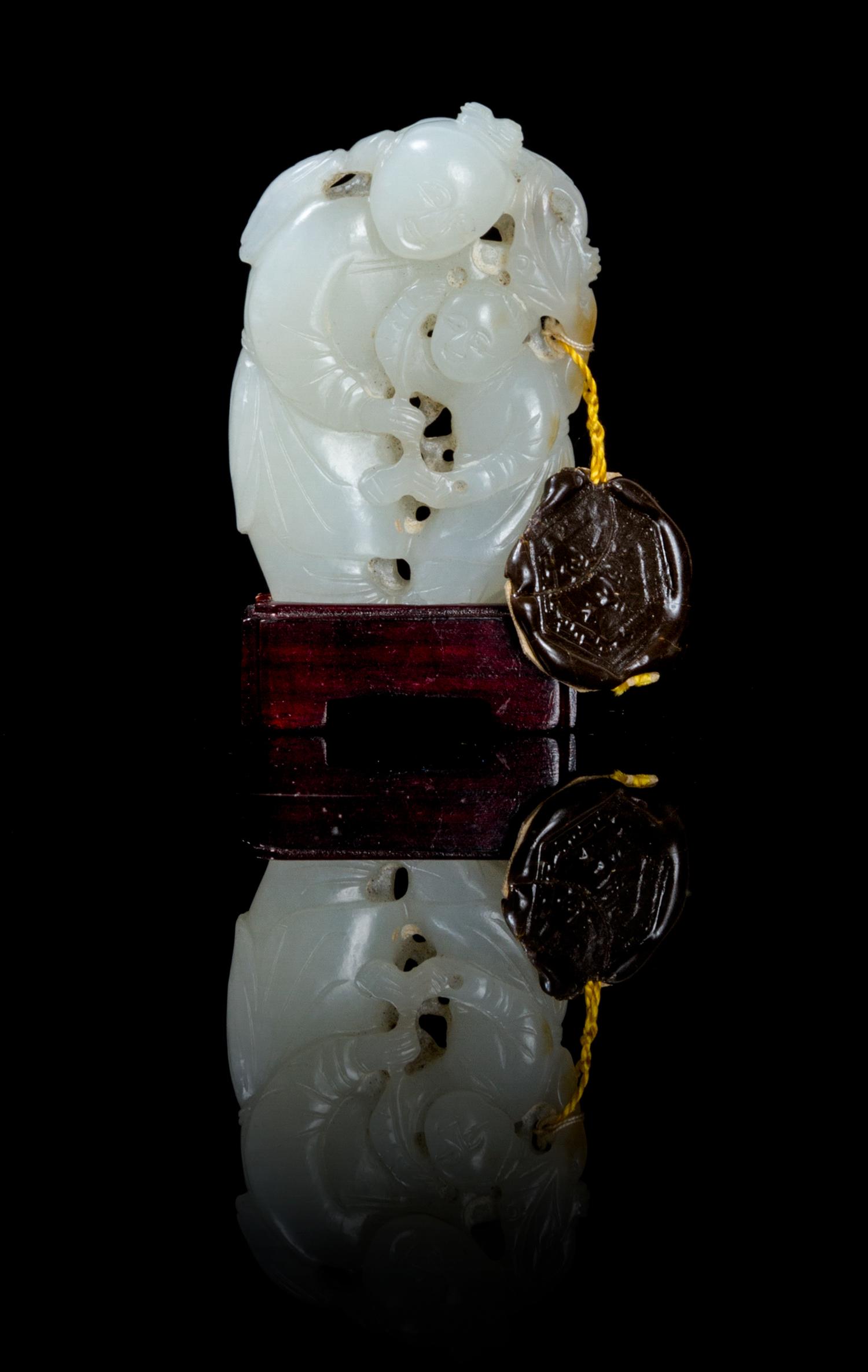 A Carved Jade Toggle Height 1 7/8 inches.