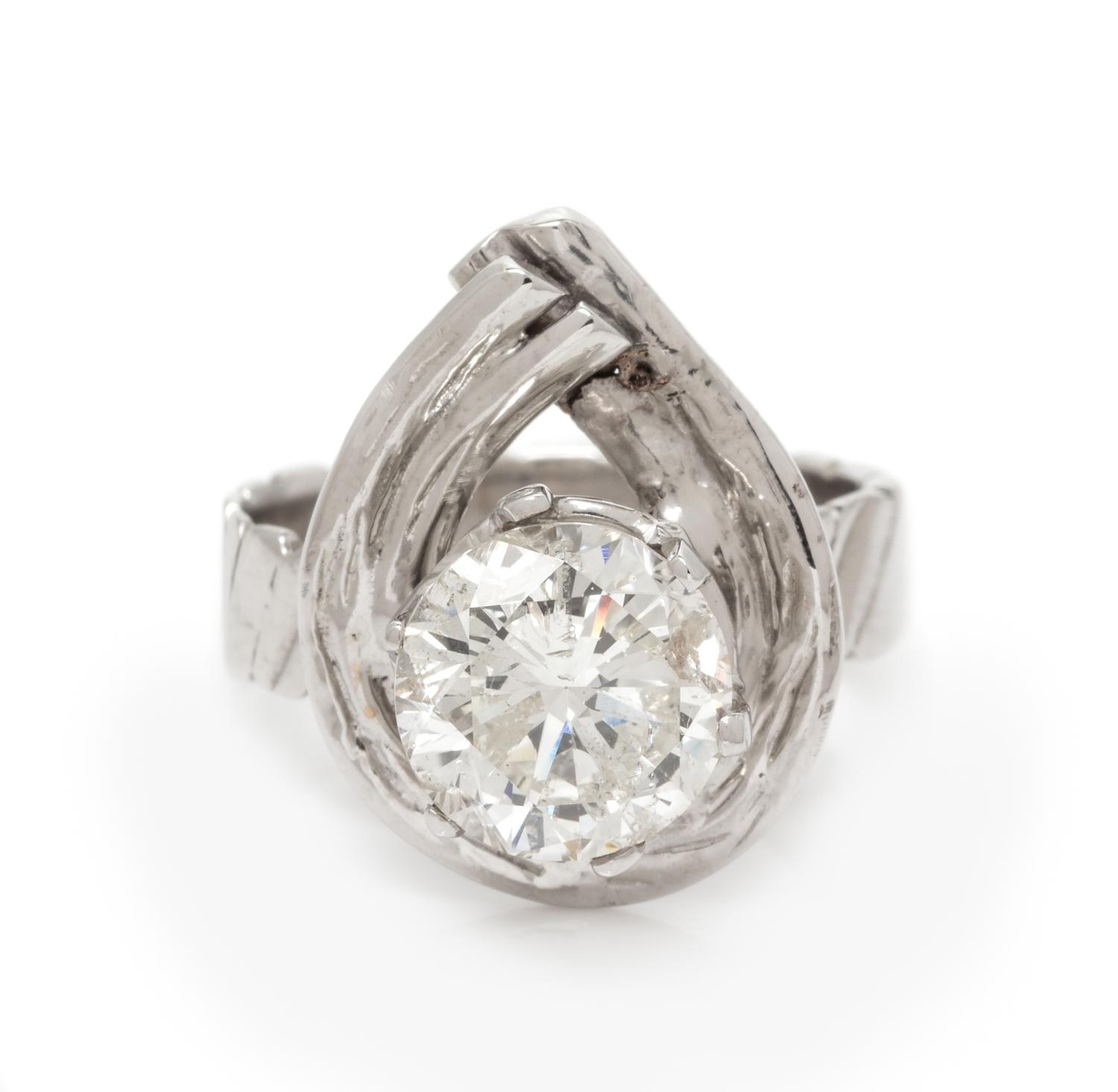 A 14 Karat White Gold and Diamond Ring, 3.70 dwts.