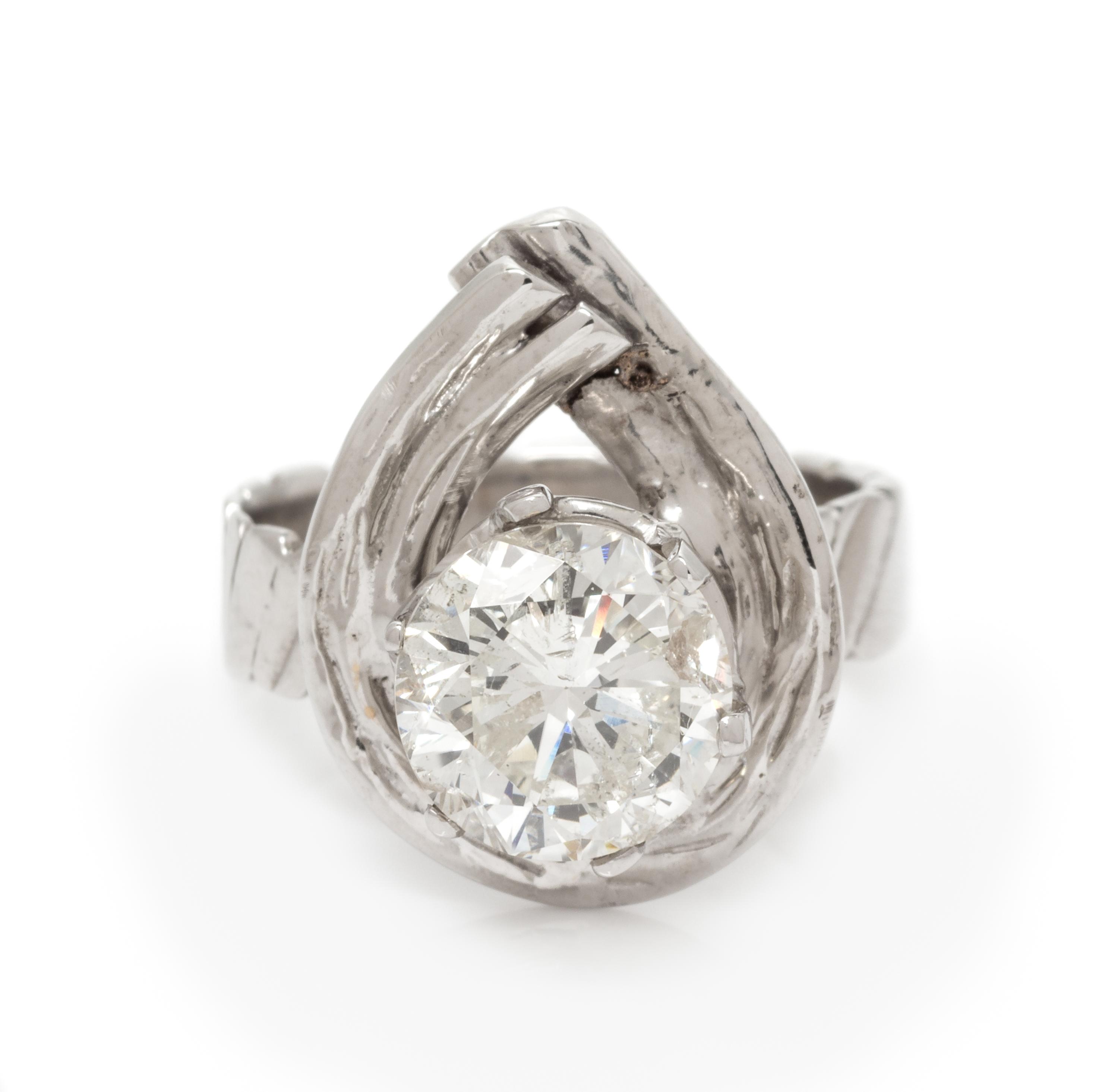 A 14 Karat White Gold and Diamond Ring, 3.70 dwts.
