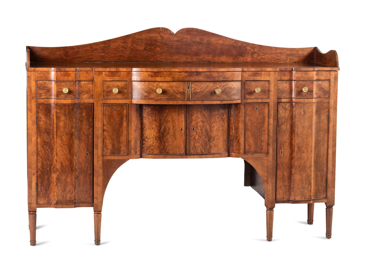 A Classical Highly Figured Cherrywood Scallop-Front Sideboard