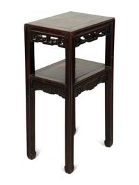 A Chinese Carved Hardwood Two-Tier Table