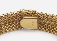 A Ladies 14K Yellow Gold Hidden Dial Watch