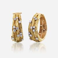 A pair of eighteen karat gold and diamond ear clips