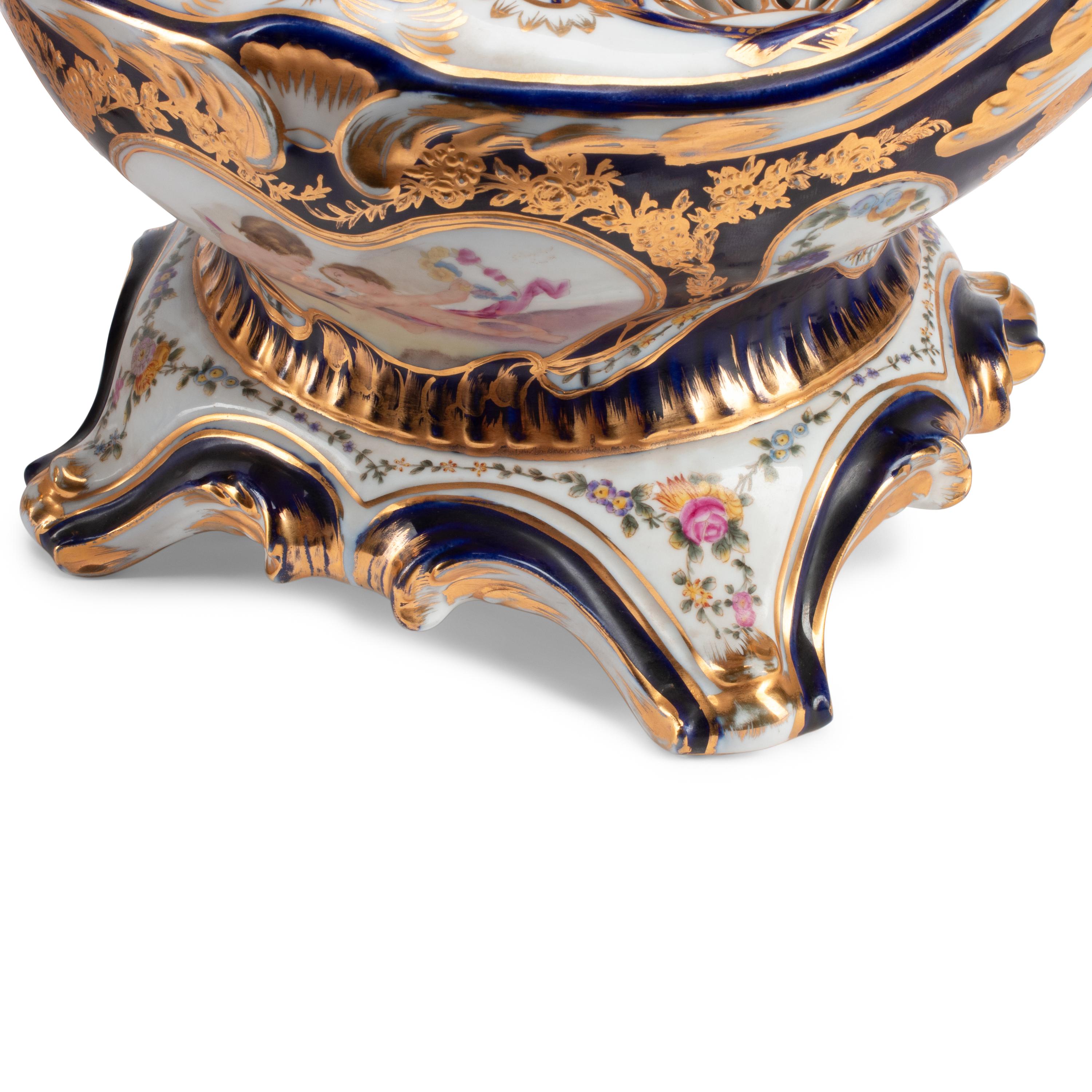 A Pair of Sèvres Style Porcelain Potpourri Vases and Covers