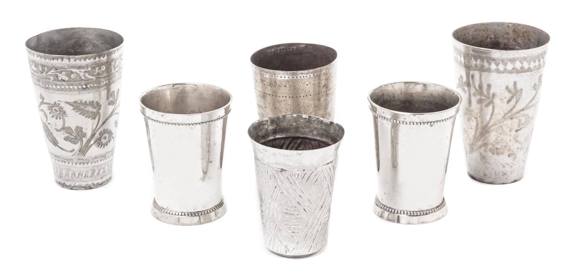 A Group of Six Metal Cups Height of tallest 5 1/2 inches.