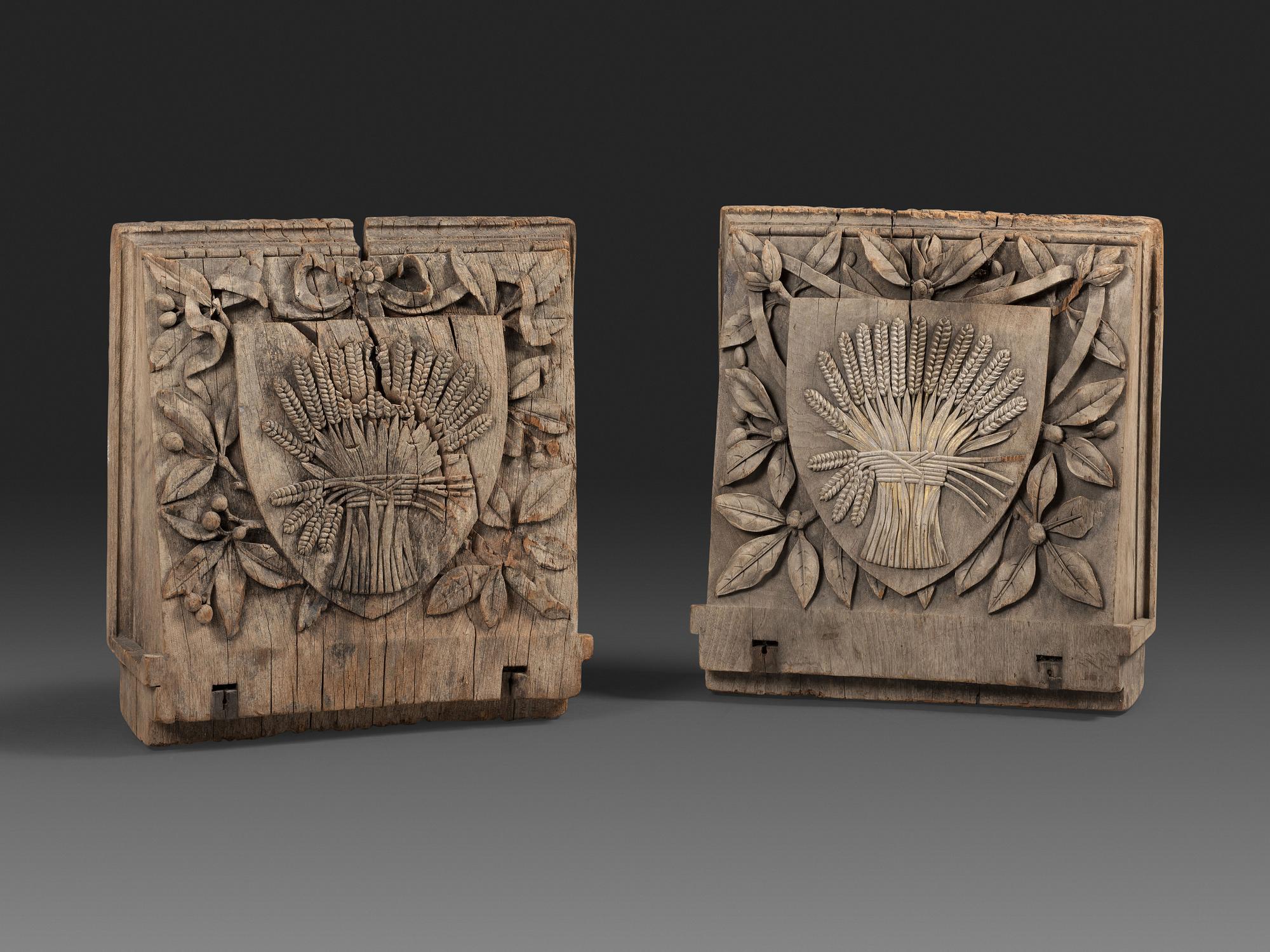 A Pair of English Carved Wood Baker's Shop Architectural Panels