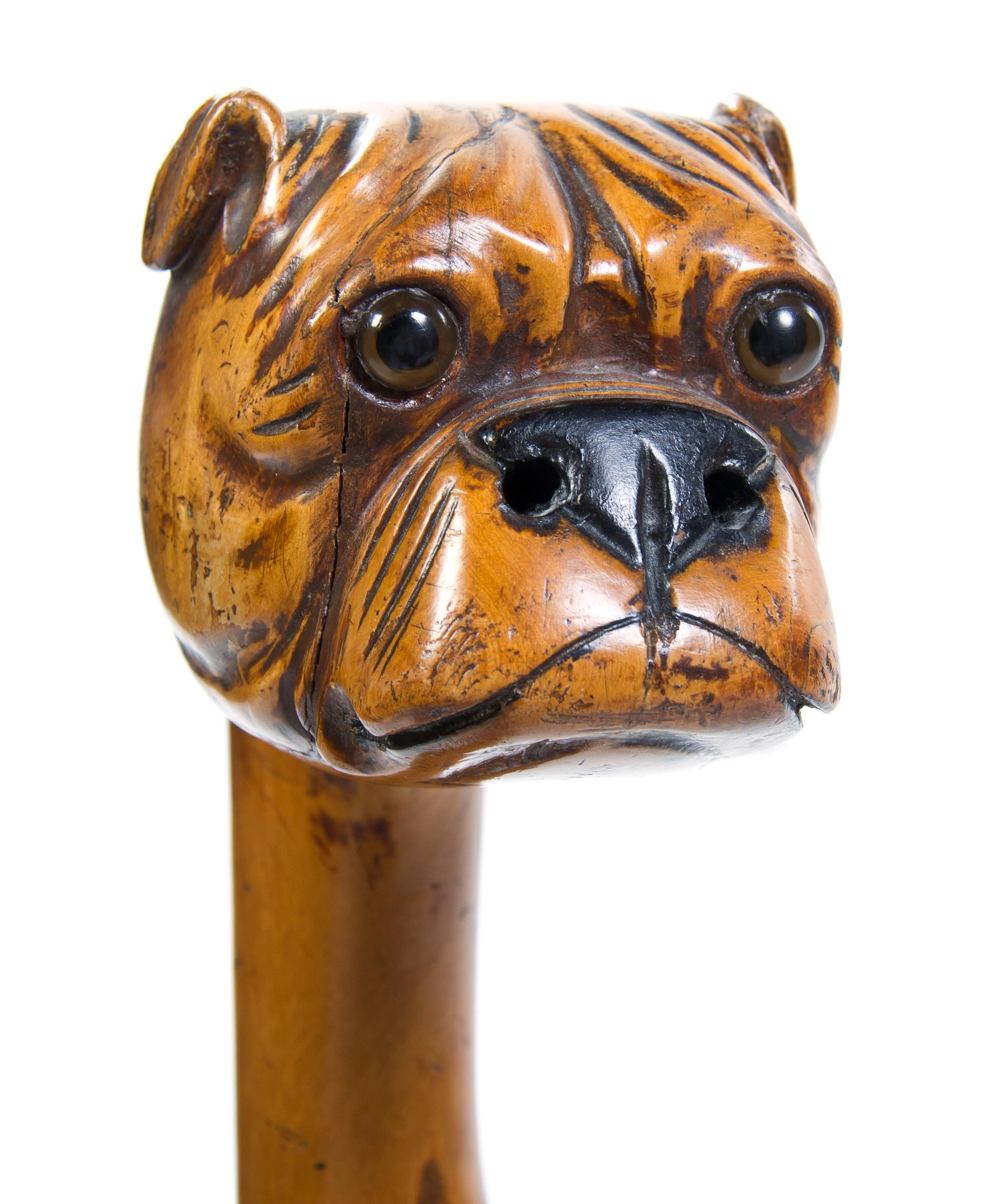 A Carved Fruitwood Cane, Height overall 36 x width of handle 4 1/2 inches.