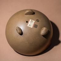 A Rare Yixing Peach-Form 'Figure' Puzzle Cup with Impressed Seals 'Chen', 'Mingyuan' and Wood Stand 陳鳴遠款醉翁桃形公道杯