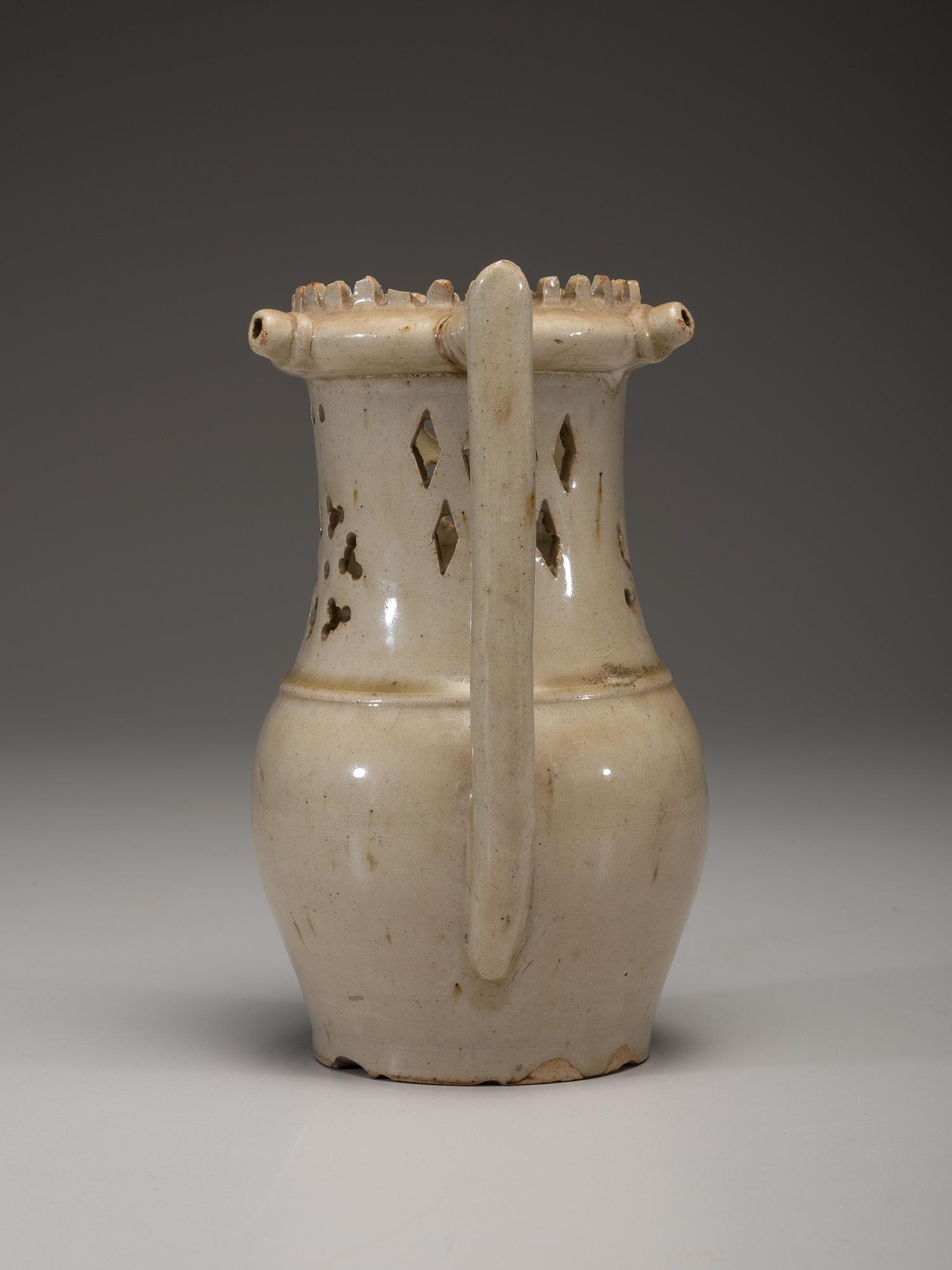 An Incised and Impressed Stoneware Puzzle Jug