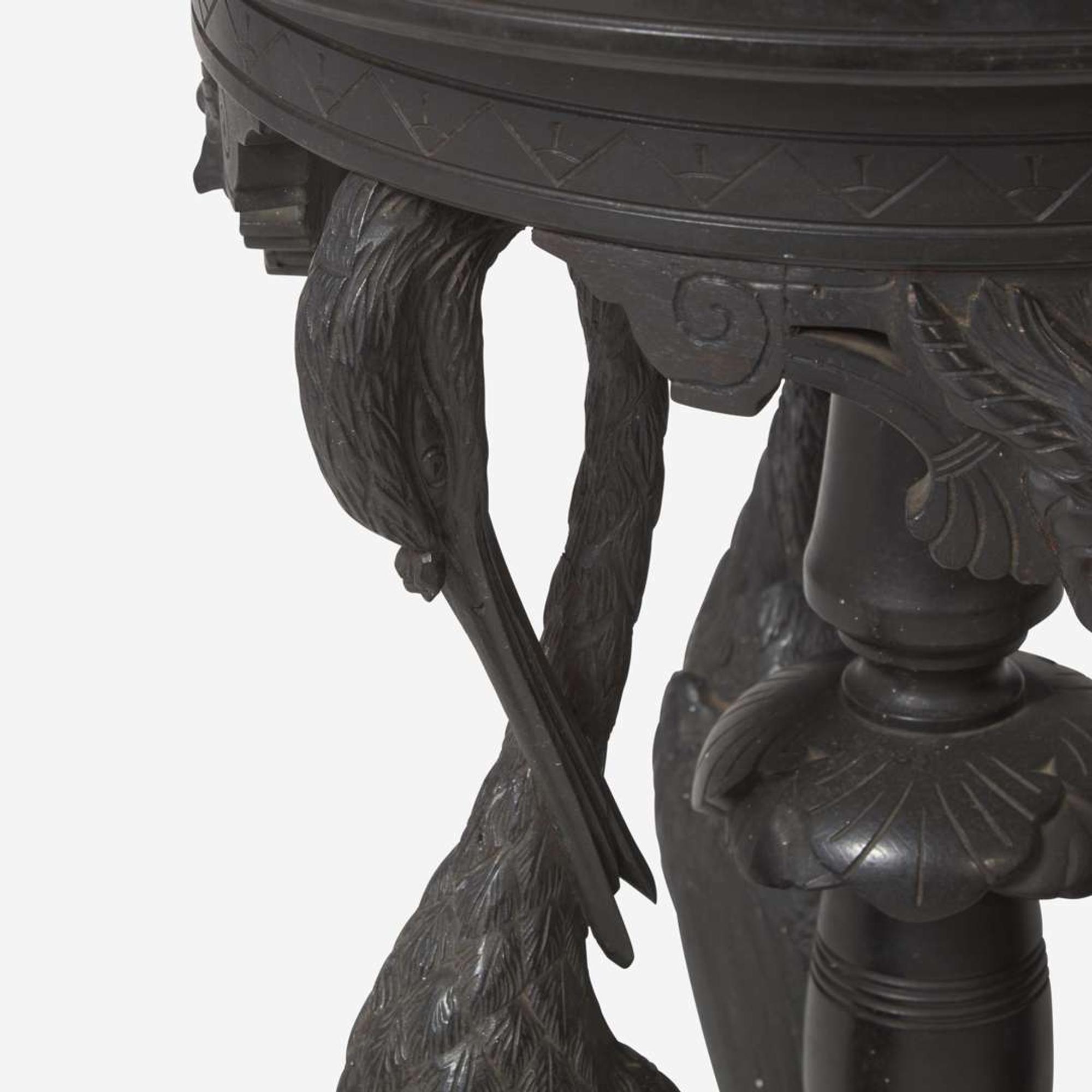 An Aesthetic Movement carved and ebonized wood pedestal with cranes late 19th century
