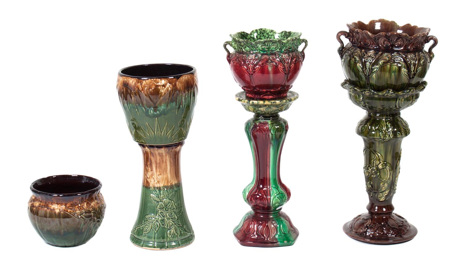 Three Majolica Jardinieres on Associated Stands Height of taller 24 inches.