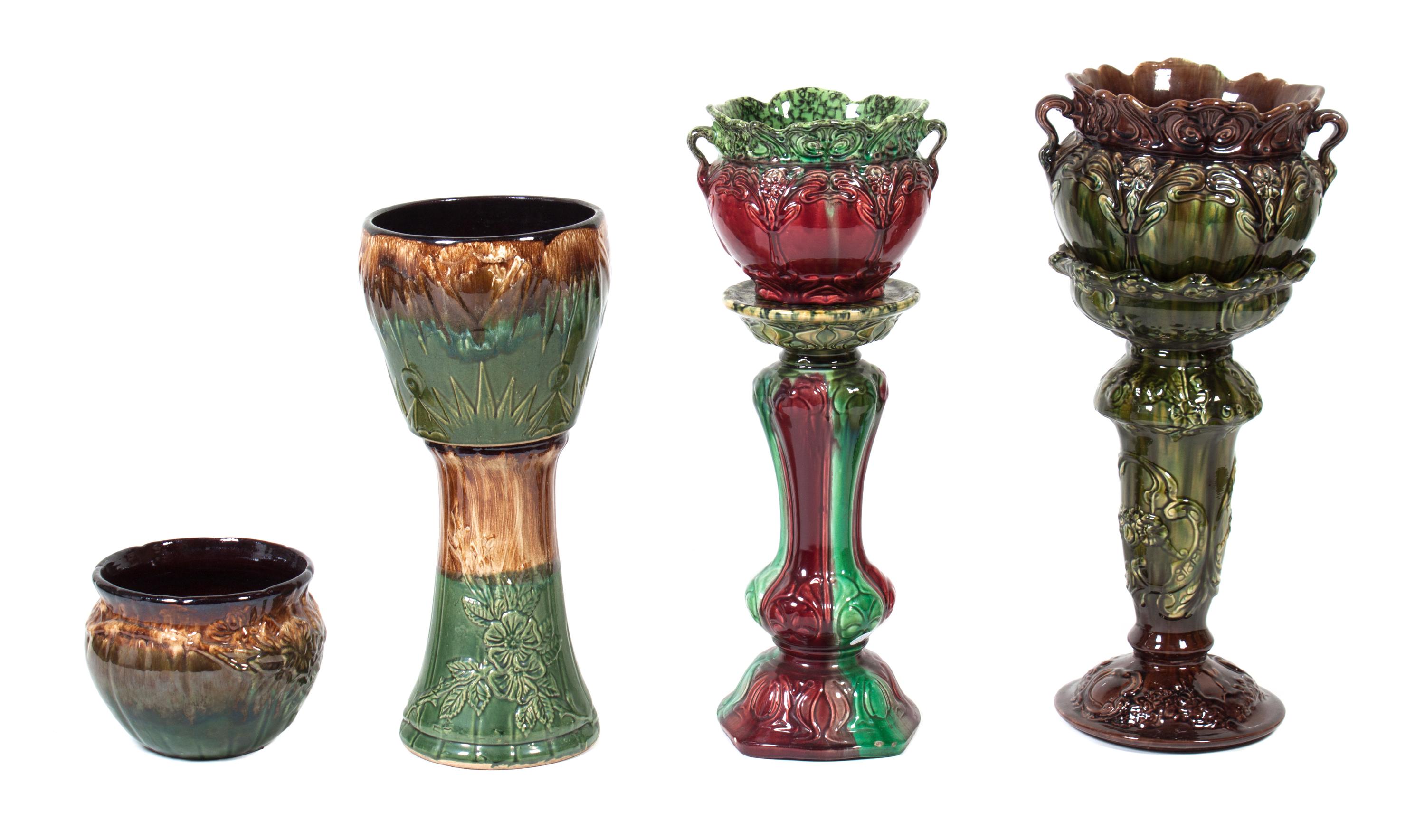 Three Majolica Jardinieres on Associated Stands Height of taller 24 inches.