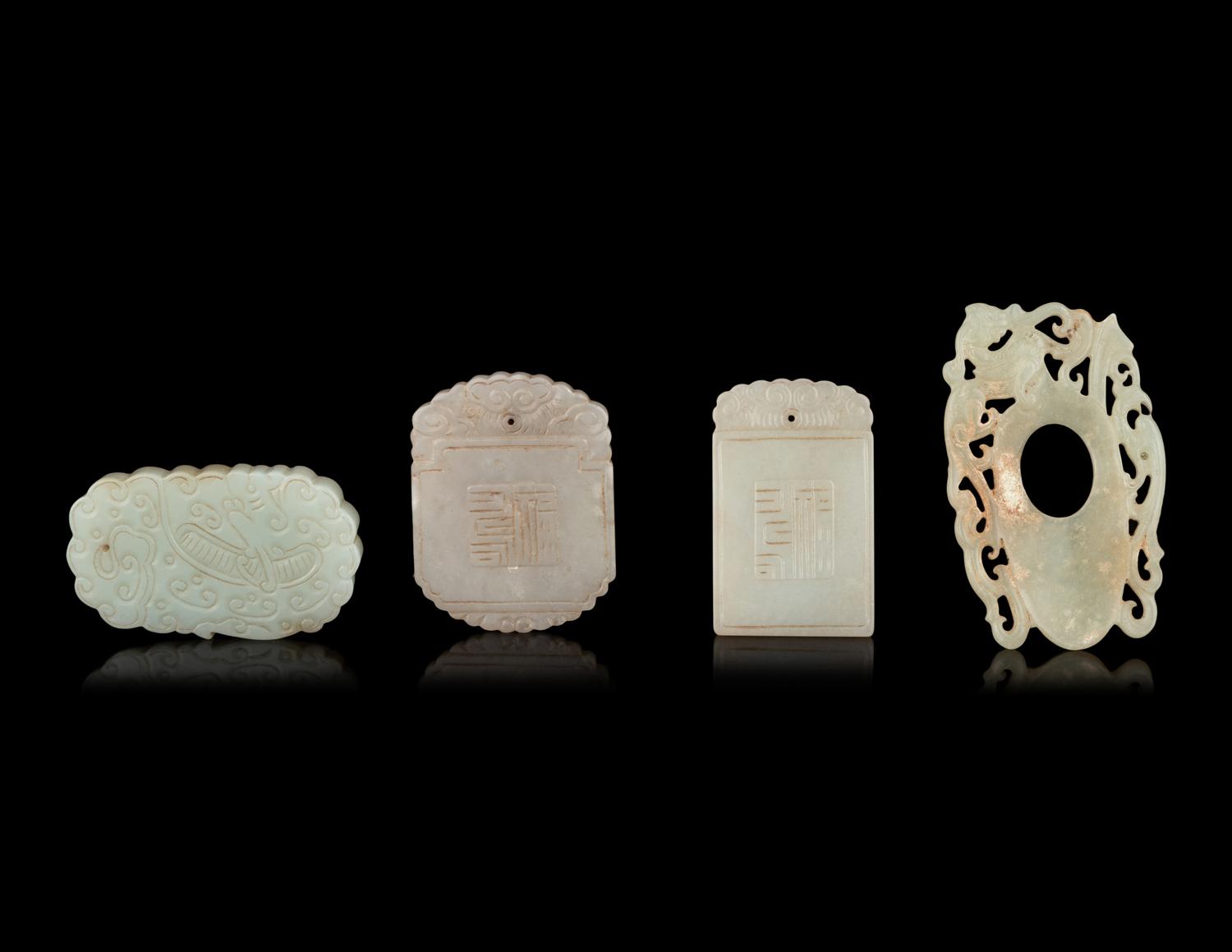 Seven Chinese Carved Celadon Jade Pendants