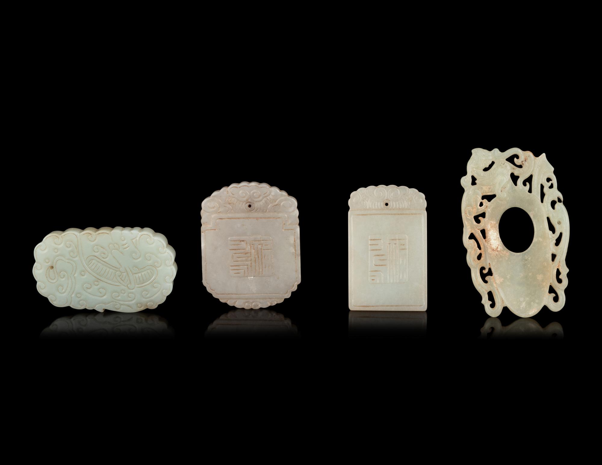 Seven Chinese Carved Celadon Jade Pendants