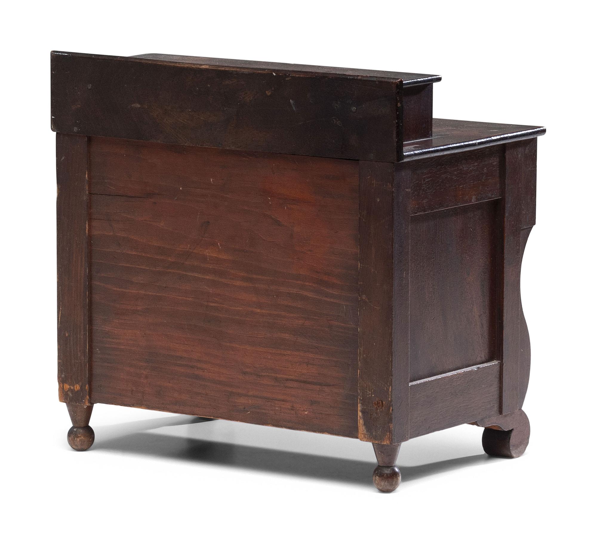 A Diminutive American Empire Mahogany Chest of Drawers