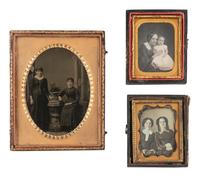 [EARLY PHOTOGRAPHY]. 14 charming cased images of family pairs and groups, mostly daguerreotypes.