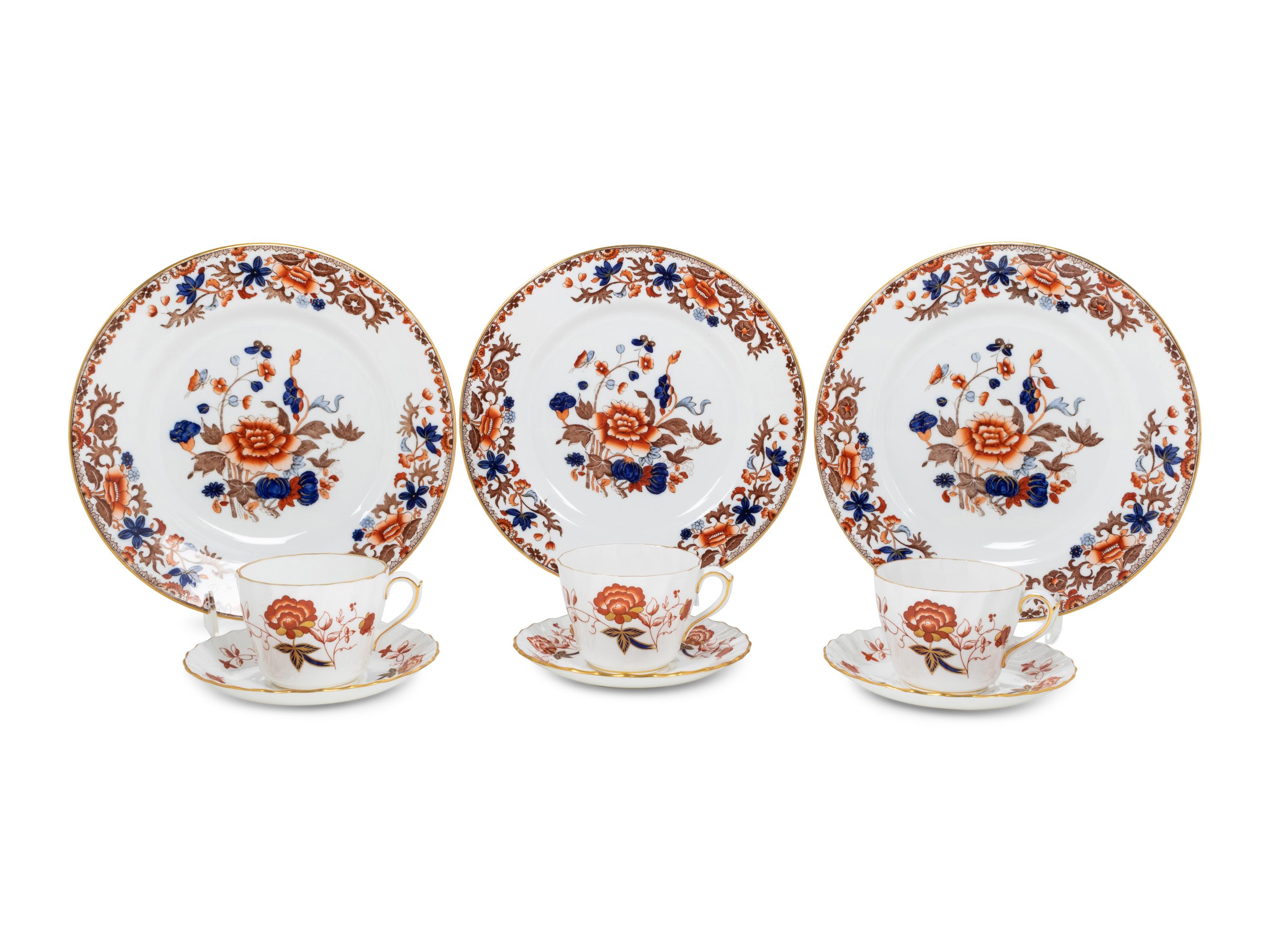 A Set of Twelve Spode Dinner Plates and a Similar Set of Royal Crown Derby Cups and Saucers