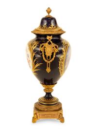 A Sèvres Style Gilt Metal Mounted Porcelain Urn and Cover