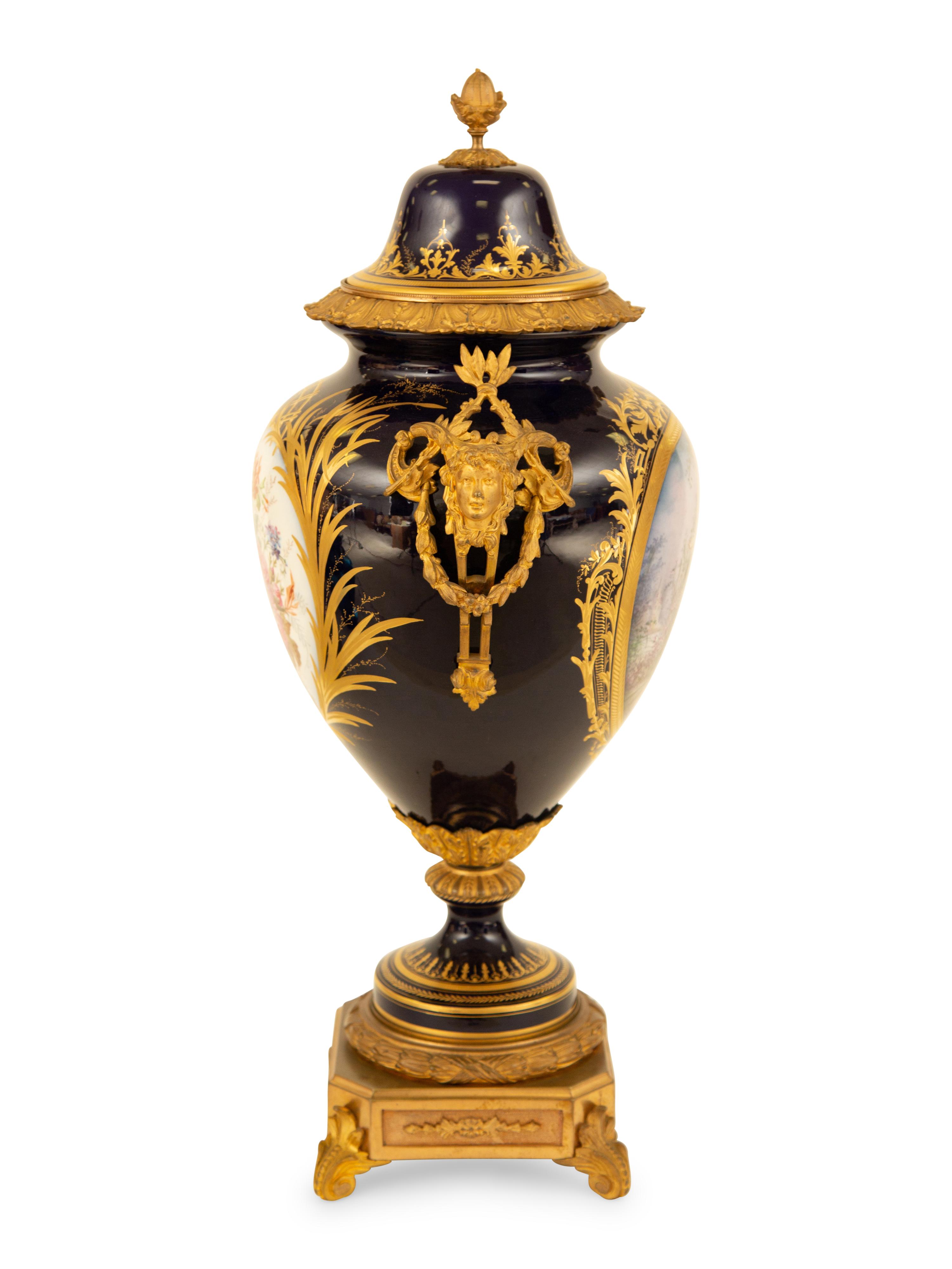 A Sèvres Style Gilt Metal Mounted Porcelain Urn and Cover
