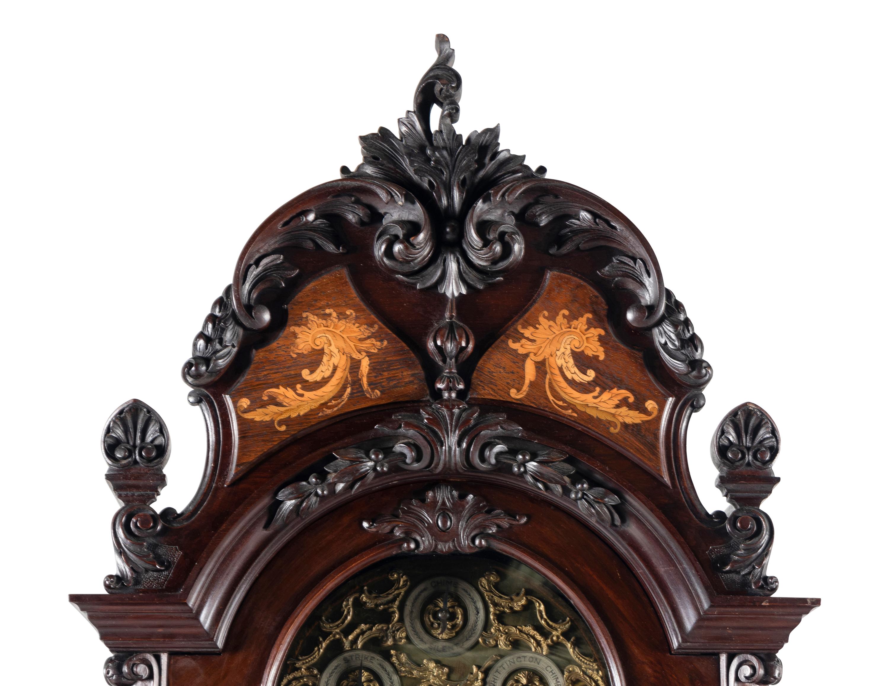 A Victorian Carved Mahogany and Marquetry Nine-Tube Tall Case Clock