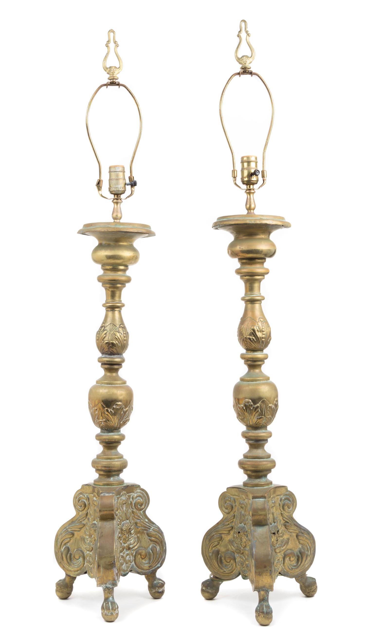 A Pair of Baroque Style Brass Prickets Height 29 inches.