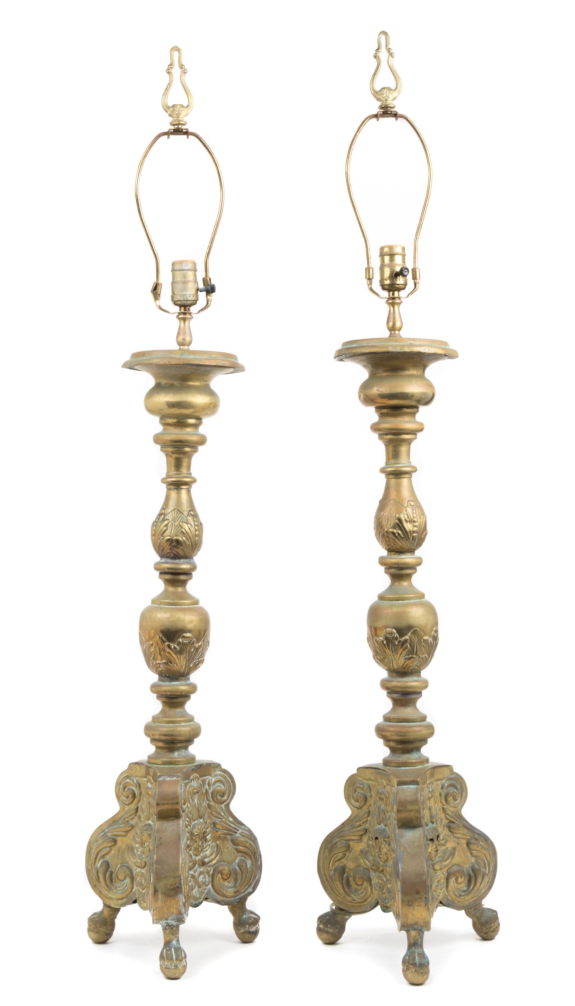 A Pair of Baroque Style Brass Prickets Height 29 inches.