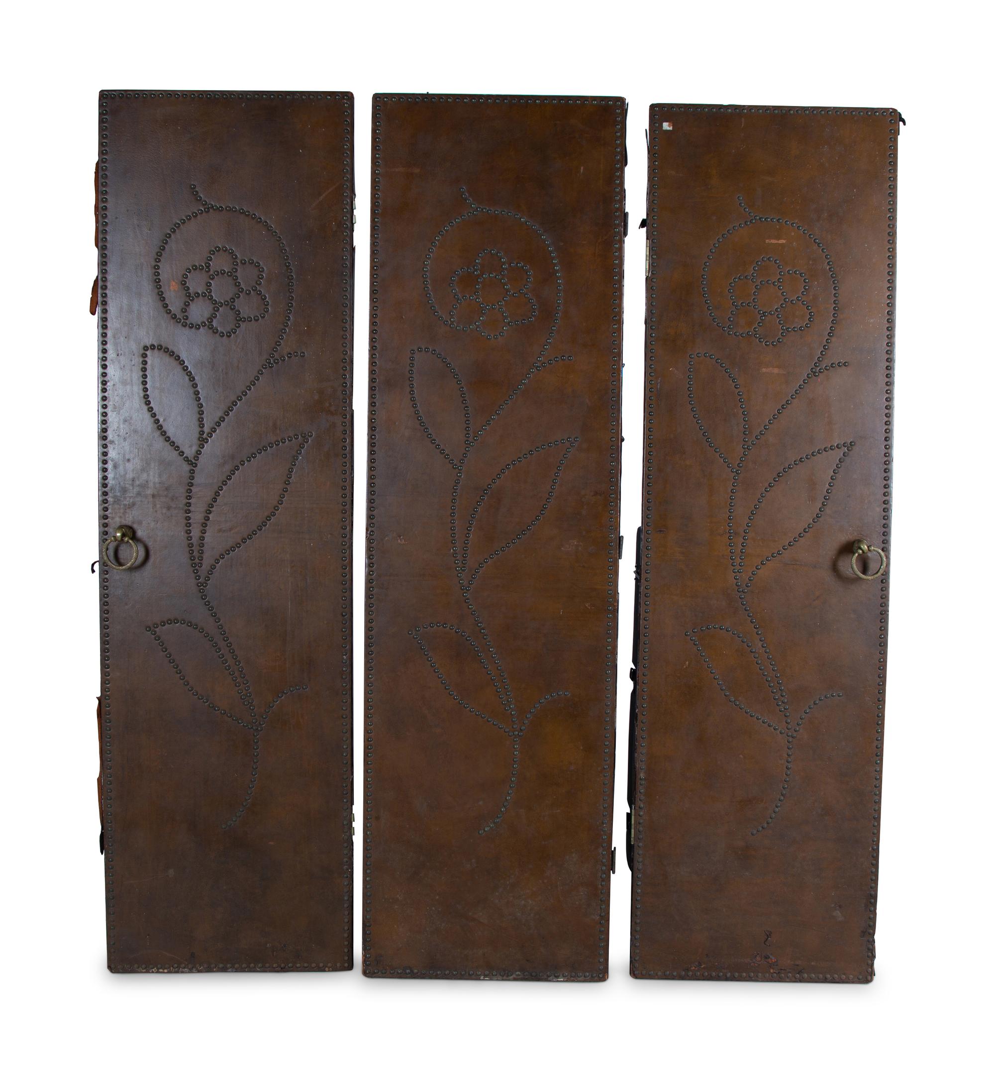 A Nailhead-Decorated Leather Three-Panel Floor Screen — 20TH CENTURY