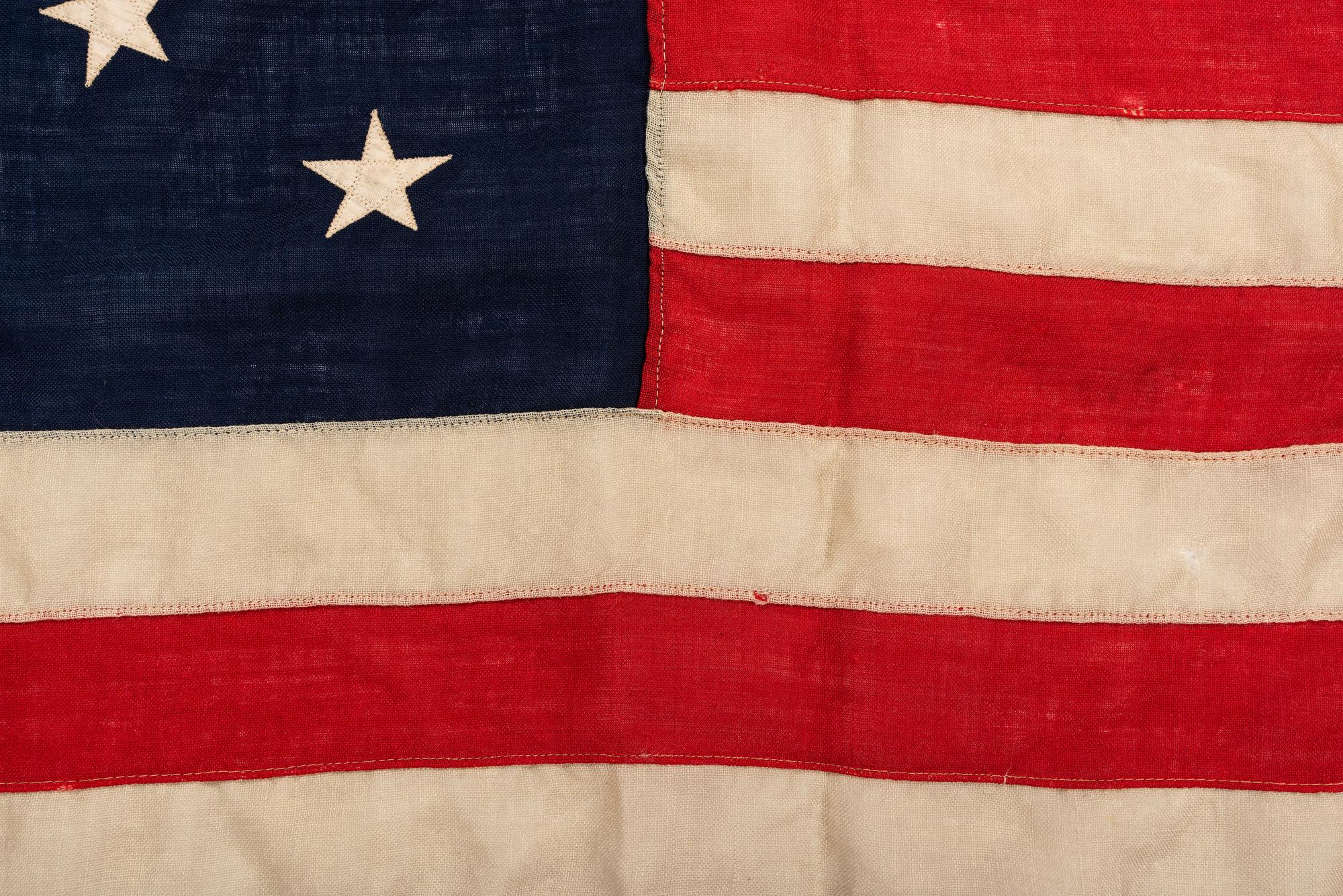 [FLAGS]. 13-star American flag with medallion pattern. Ca late 19th-early 20th century.