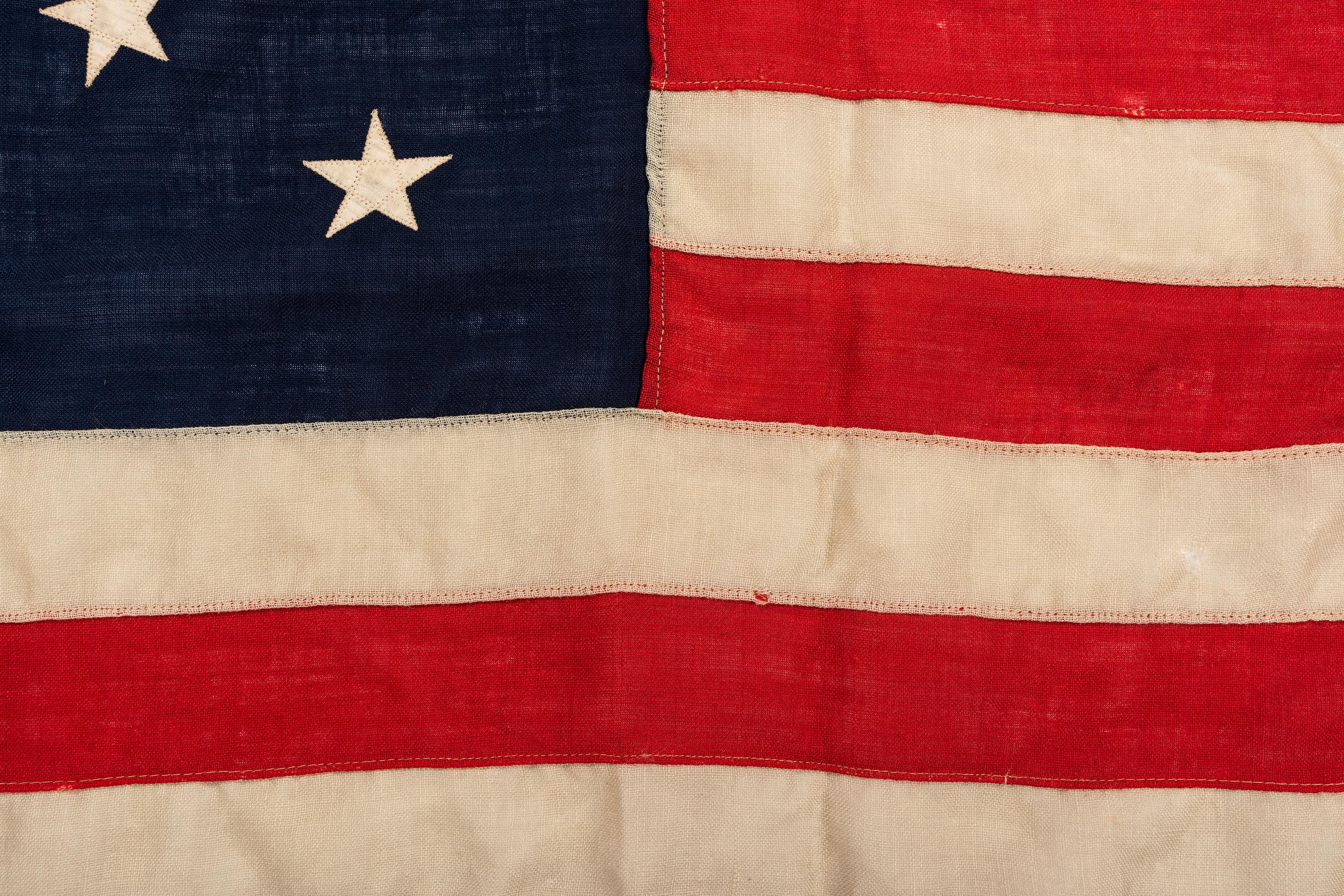 [FLAGS]. 13-star American flag with medallion pattern. Ca late 19th-early 20th century.
