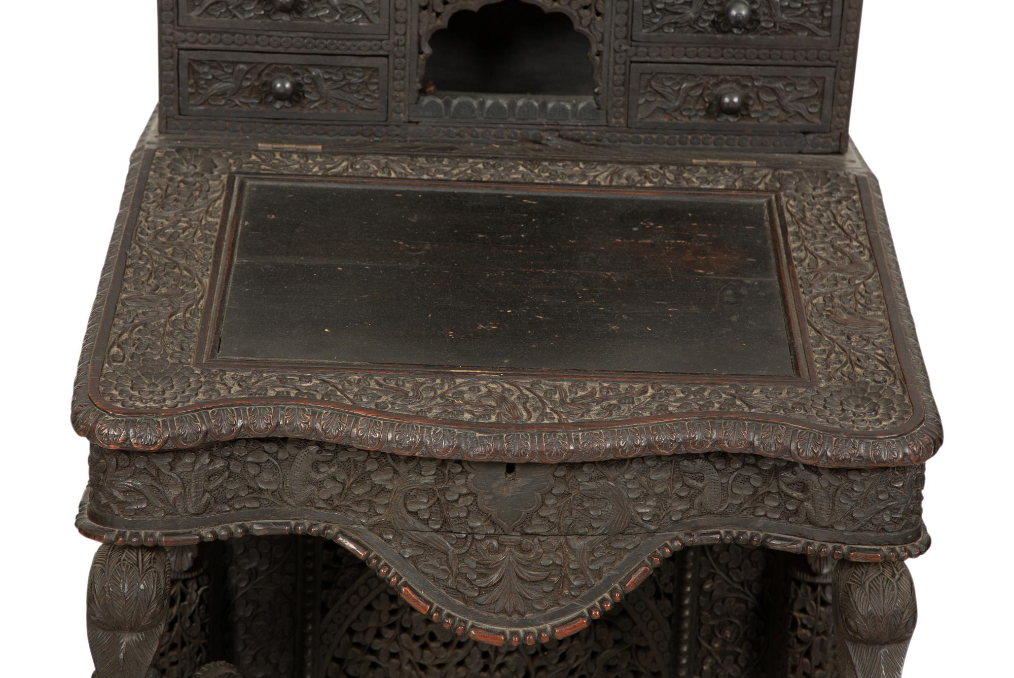 An Anglo-Burmese Carved Teak Davenport Desk
