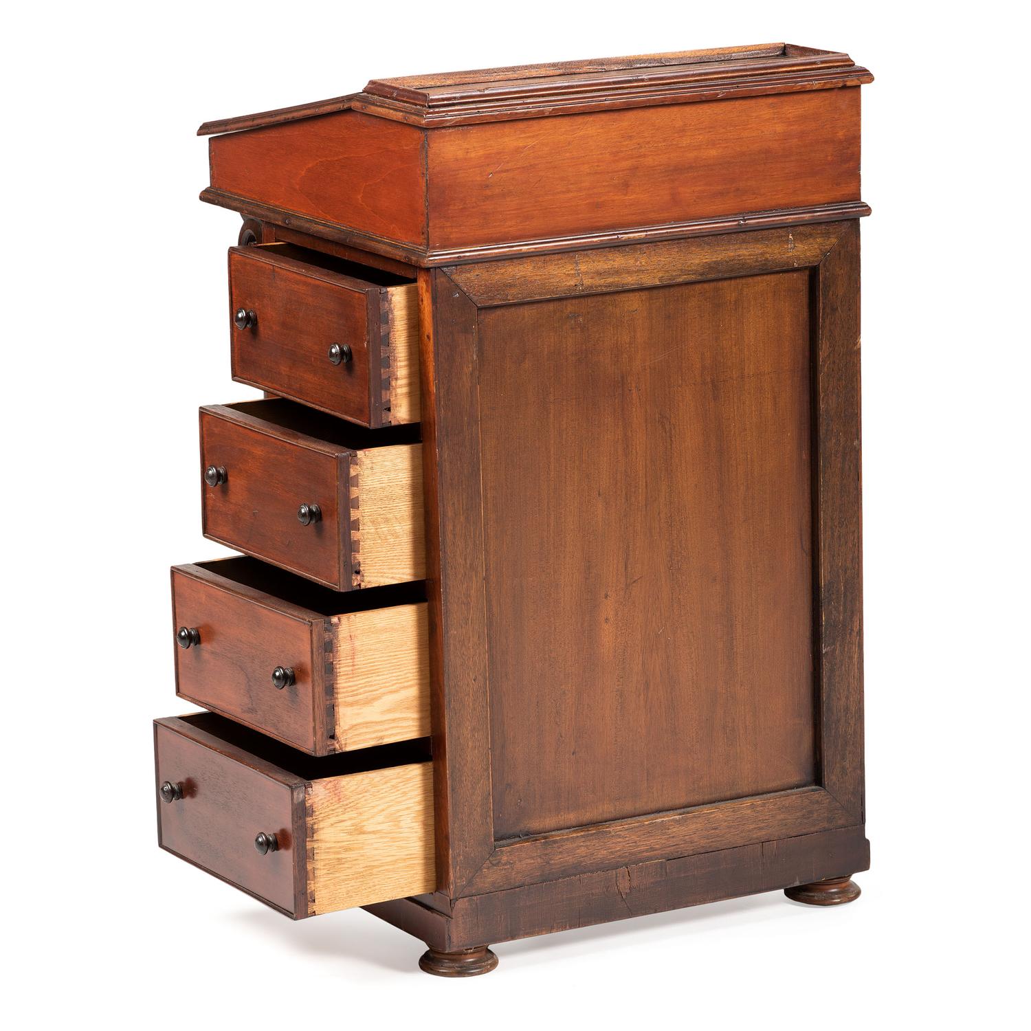 A Victorian Carved Mahogany Davenport Desk