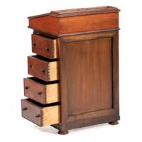 A Victorian Carved Mahogany Davenport Desk