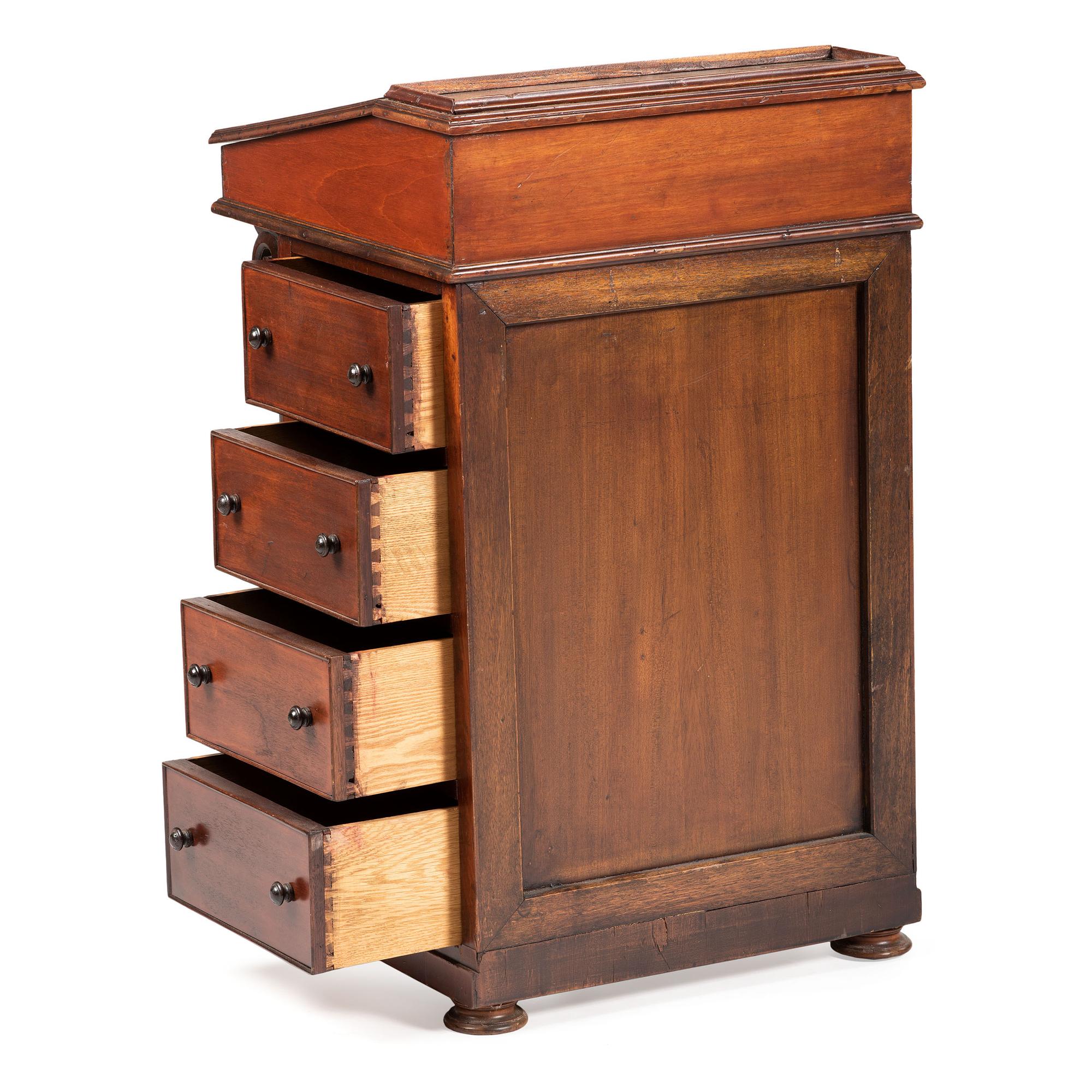 A Victorian Carved Mahogany Davenport Desk
