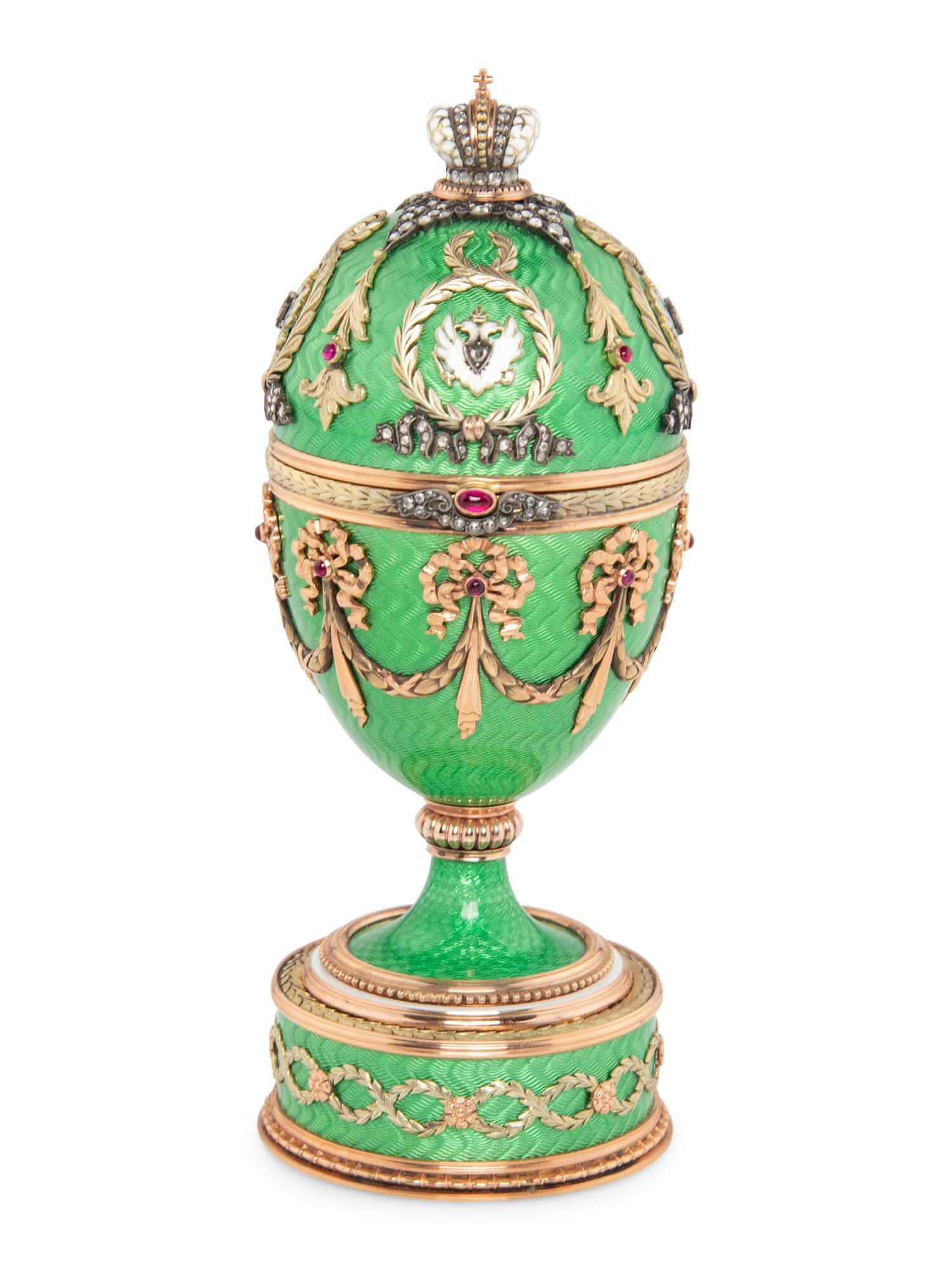 A Gold, Guilloché Enamel and Gemstone-Mounted Surprise Egg