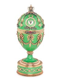 A Gold, Guilloché Enamel and Gemstone-Mounted Surprise Egg