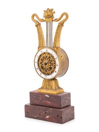 An Empire Style Gilt Bronze and Rouge Marble Clock