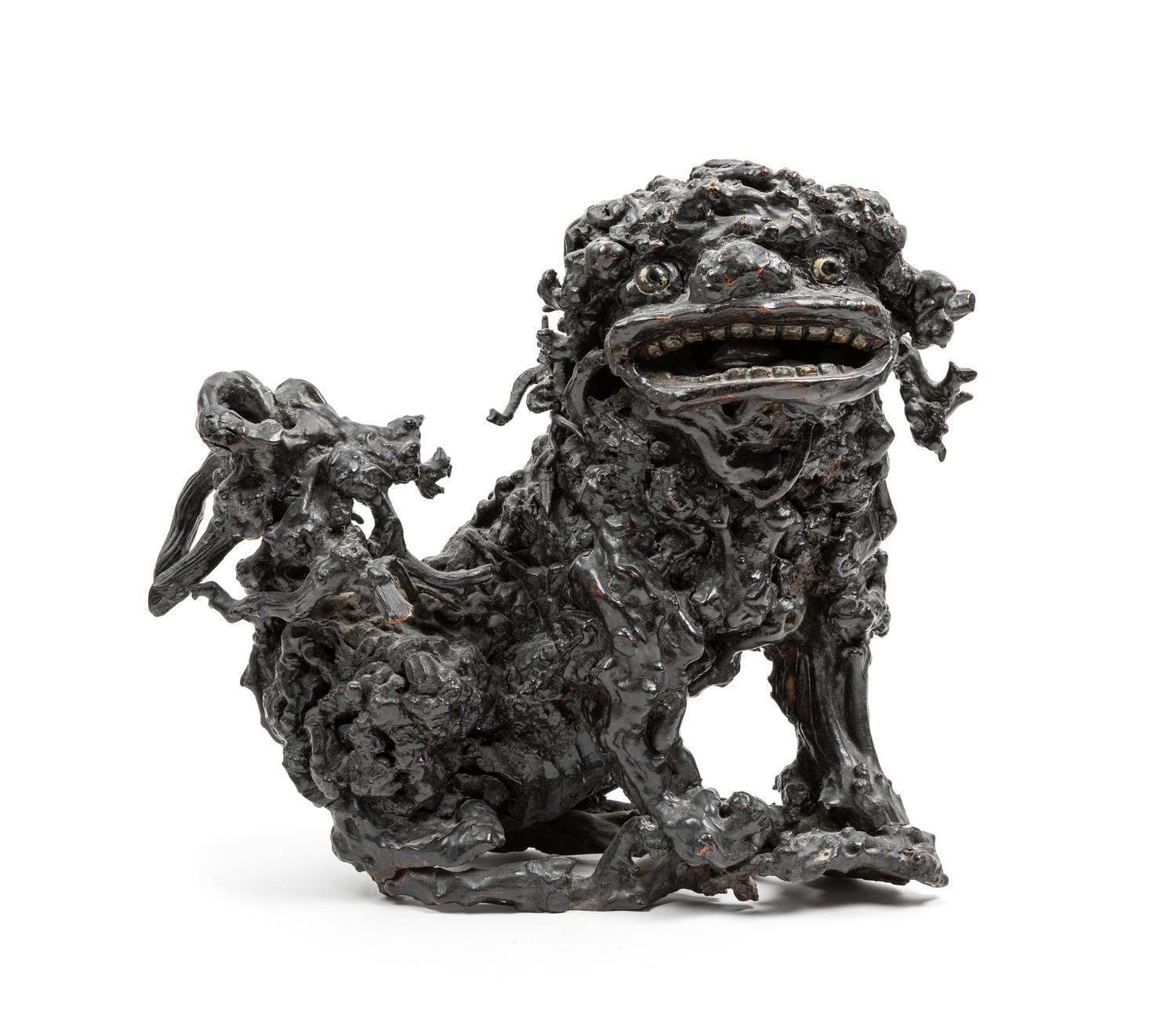 A Chinese Carved Lychee Wood Figure of a Fu Lion Height 13 1/2 inches. — 19TH CENTURY