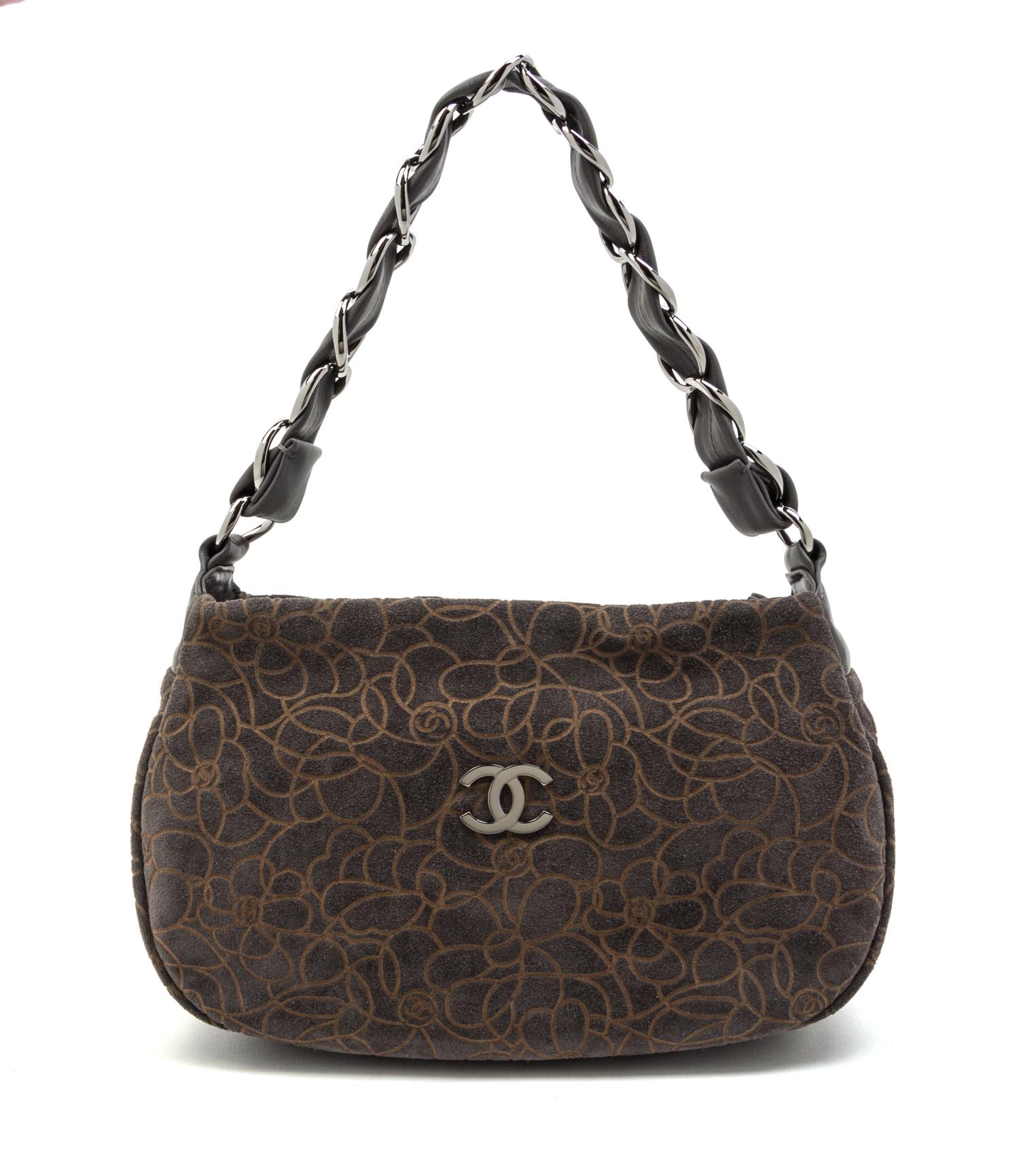 A Chanel Grey Suede Camellia Bag, 11 x 6 1/2 x 3 inches.
