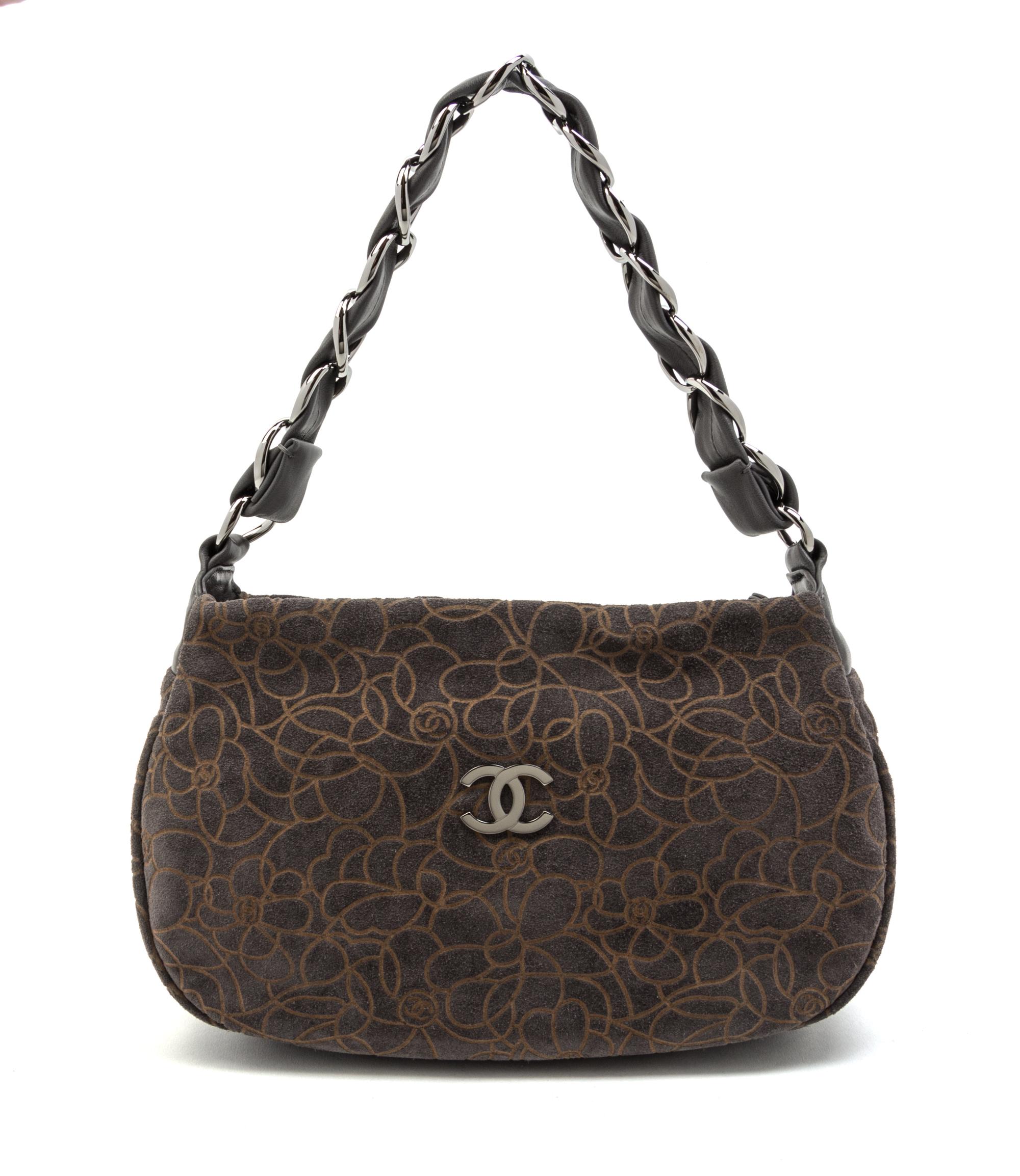 A Chanel Grey Suede Camellia Bag, 11 x 6 1/2 x 3 inches.