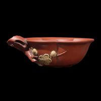 A Rare Yixing 'Prunus Blossom' Coupe with Impressed Seal 'Mingyuan', and Wood Stand 陳鳴遠款朱泥紫砂梅花杯