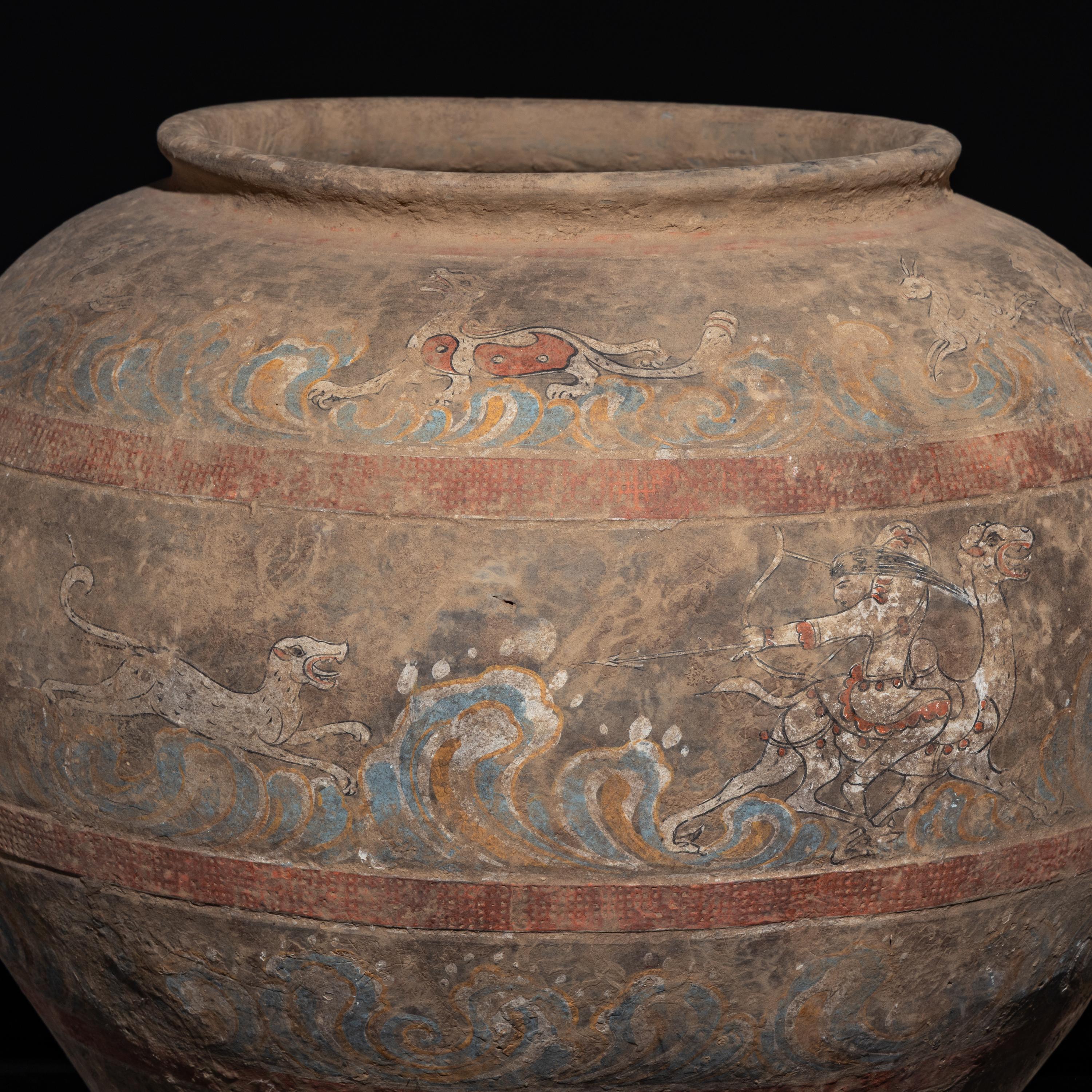 A Chinese Painted Pottery 'Mythical Beast' Jar, Han Dynasty — 漢 灰陶彩繪狩獵圖大罐