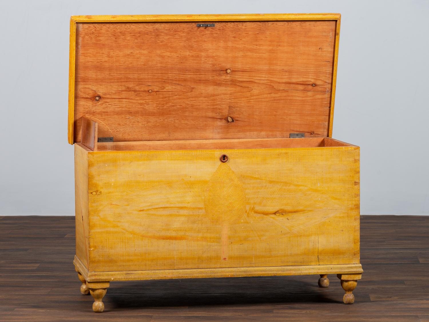 A Country Yellow and Red Paint Decorated Pine Blanket Chest