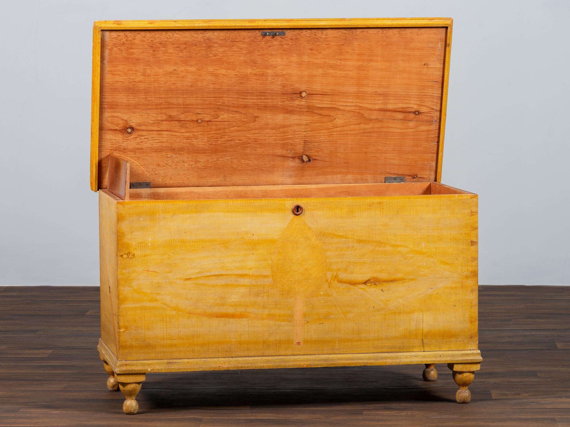 A Country Yellow and Red Paint Decorated Pine Blanket Chest