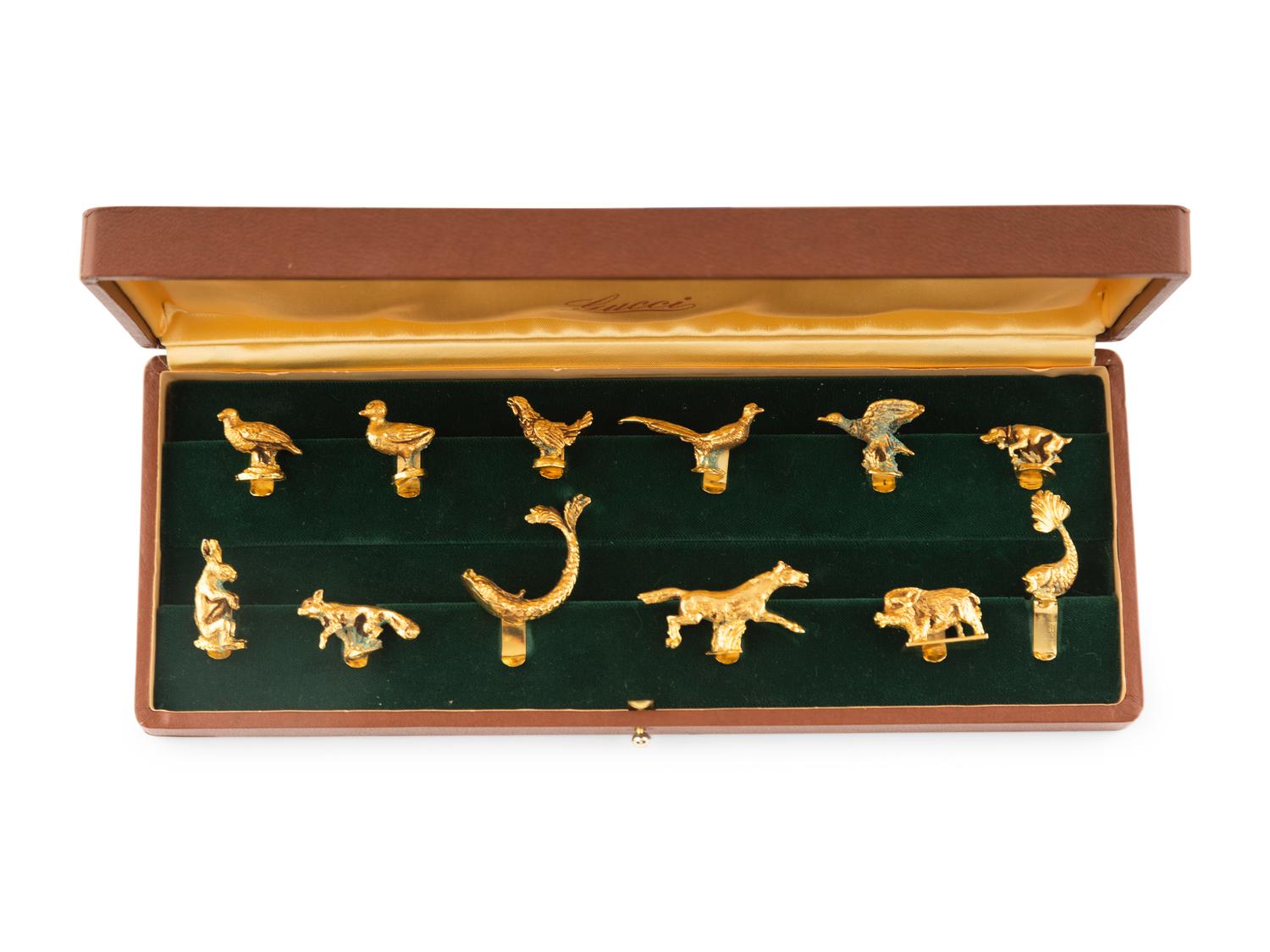 A Cased Set of Twelve Animal Stemware Charms Retailed by Gucci