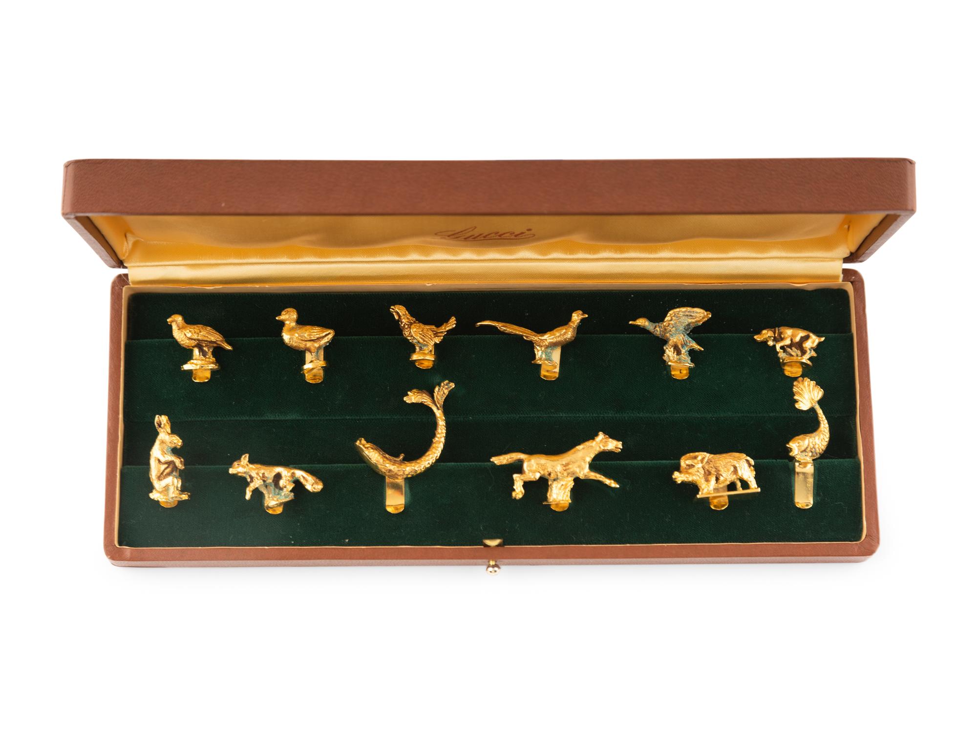 A Cased Set of Twelve Animal Stemware Charms Retailed by Gucci