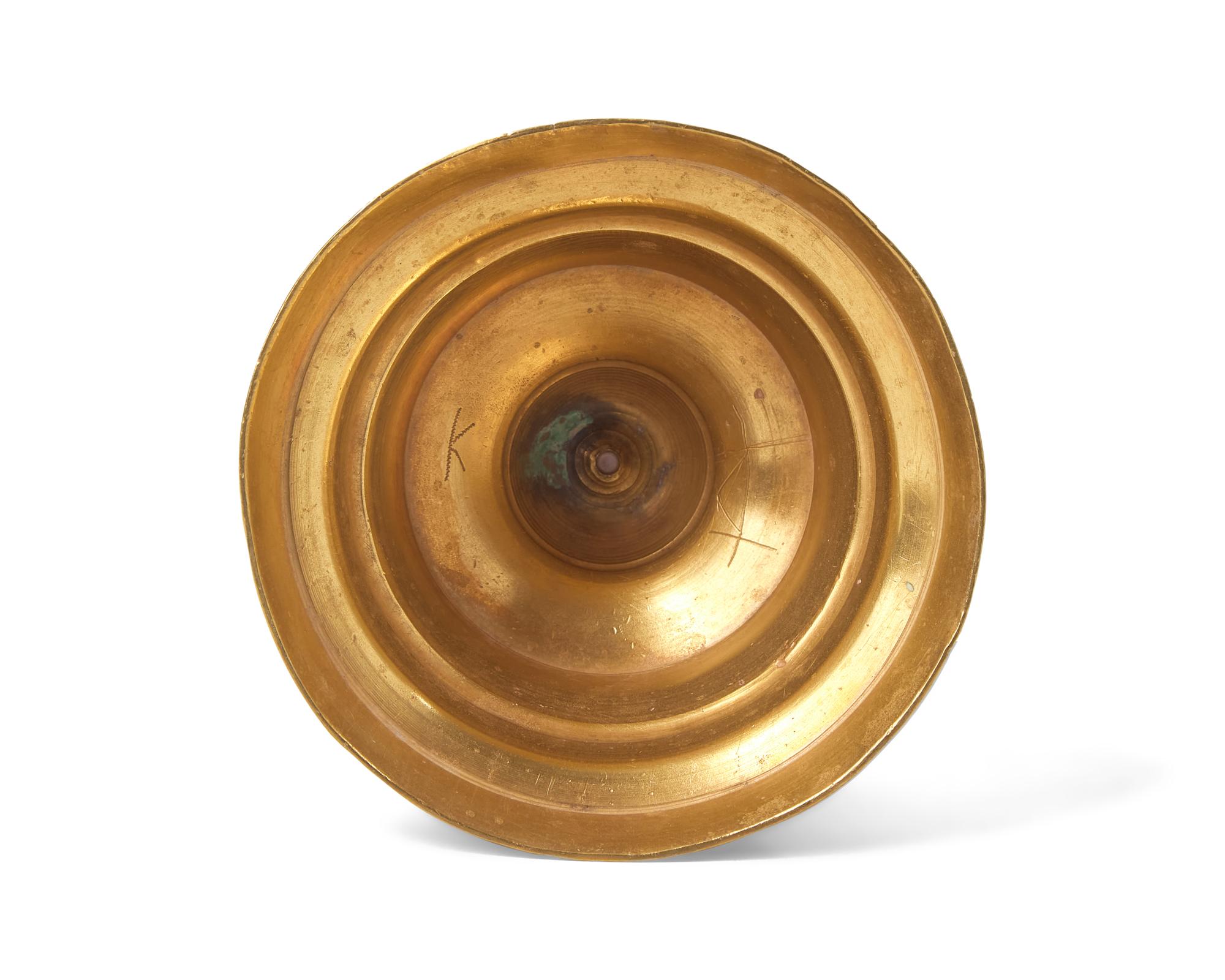 A Flemish Brass Double-Light Candlestick