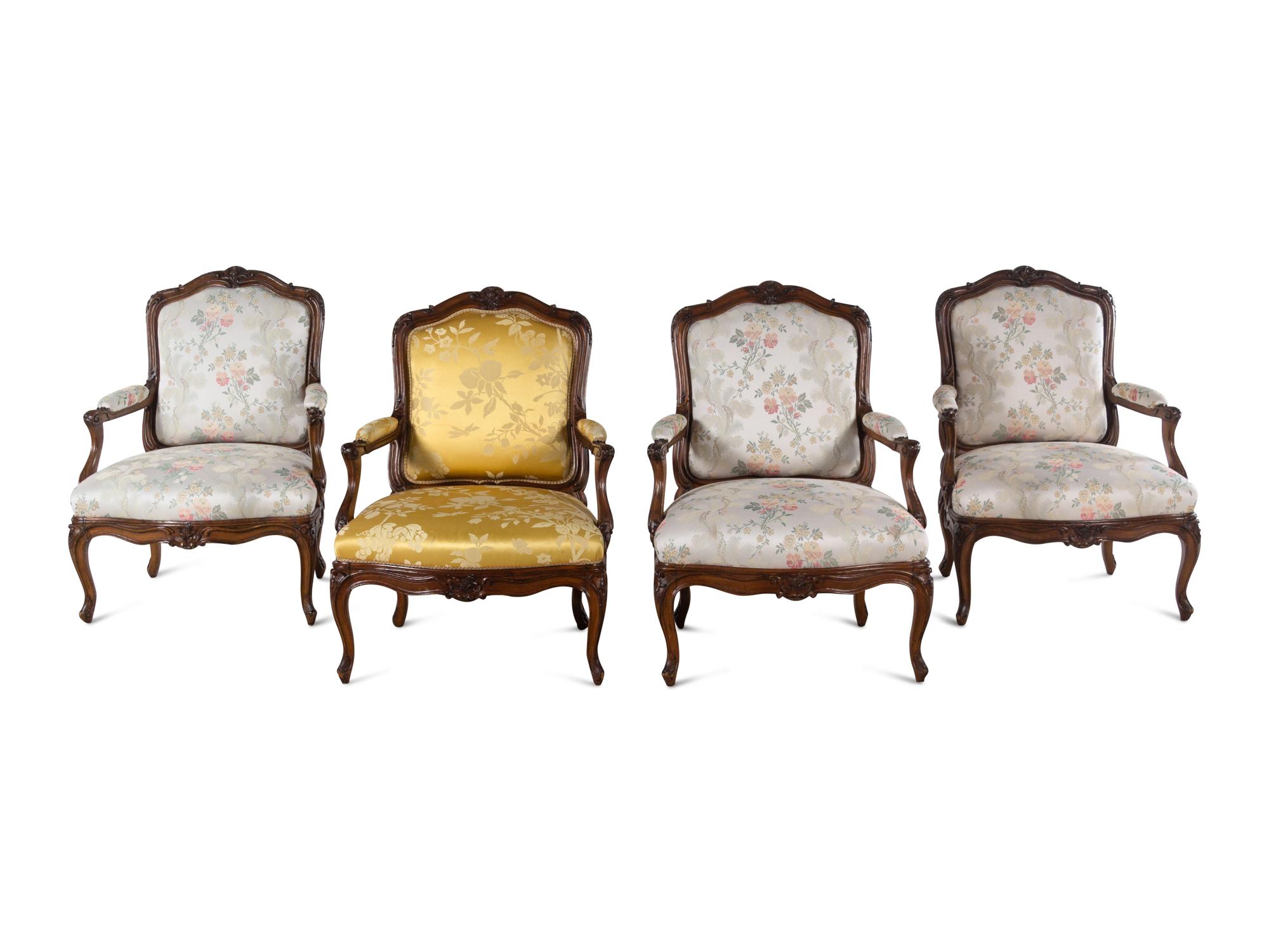 A Set of Four Louis XV Style Walnut Fauteuils