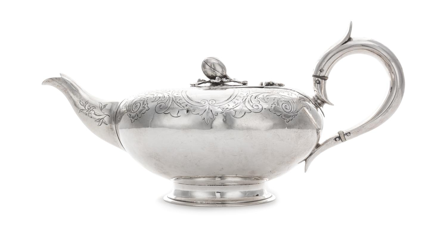 A Victorian Silver Teapot, George John Richards, London, 1865, of squat form, having a gourd finial surmounting a C-scroll, floral and