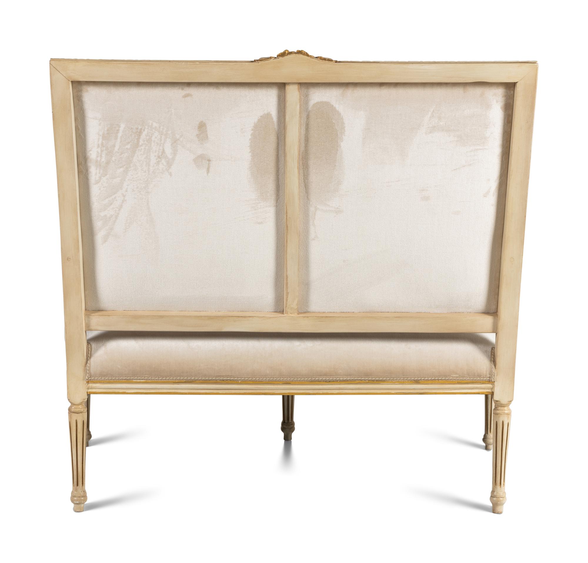 A Louis XVI Style Painted and Parcel Gilt Settee