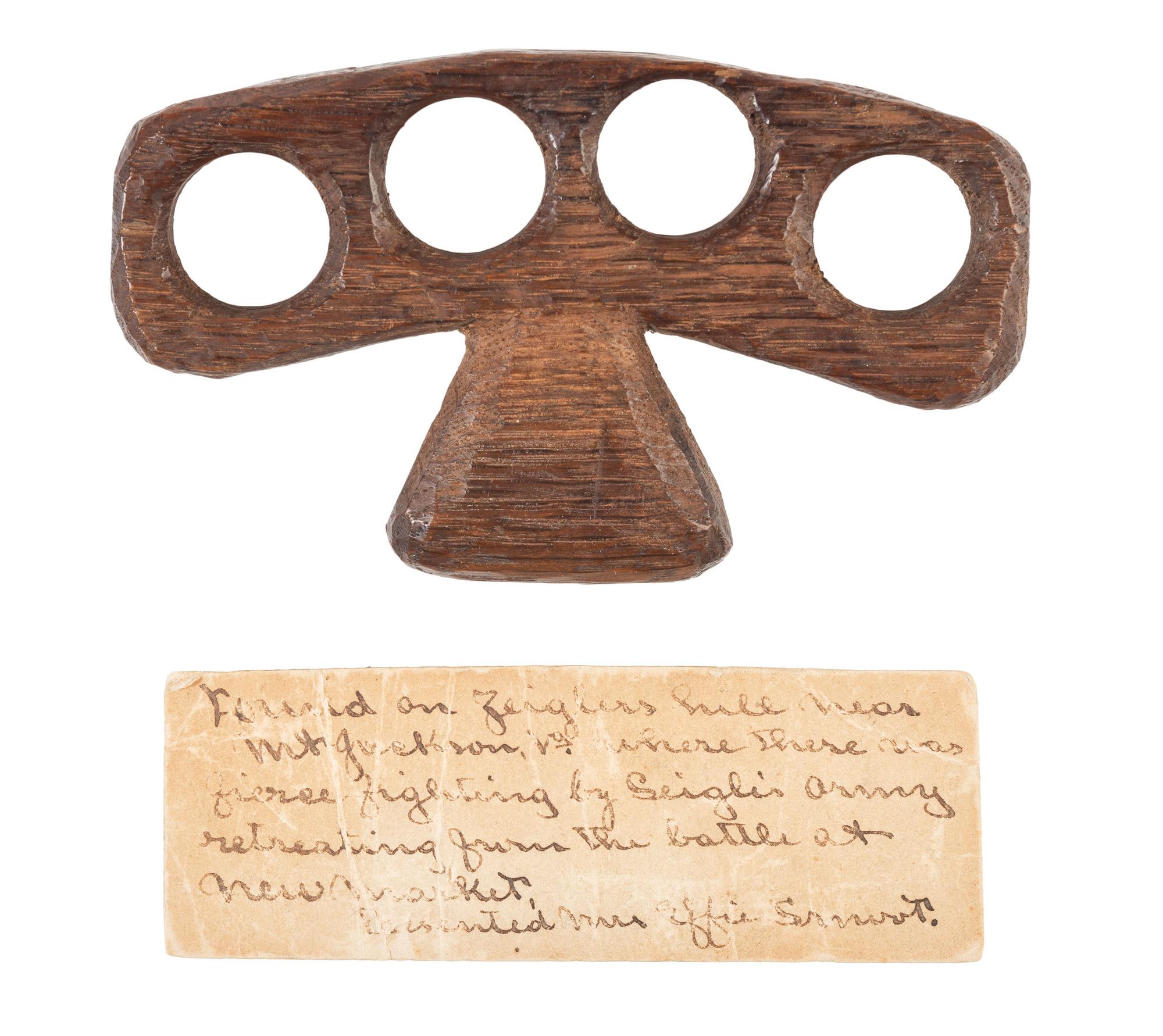 Civil War soldier carved wooden knuckles found on line of retreat from New Market Battlefield, Virginia. [May 1864].